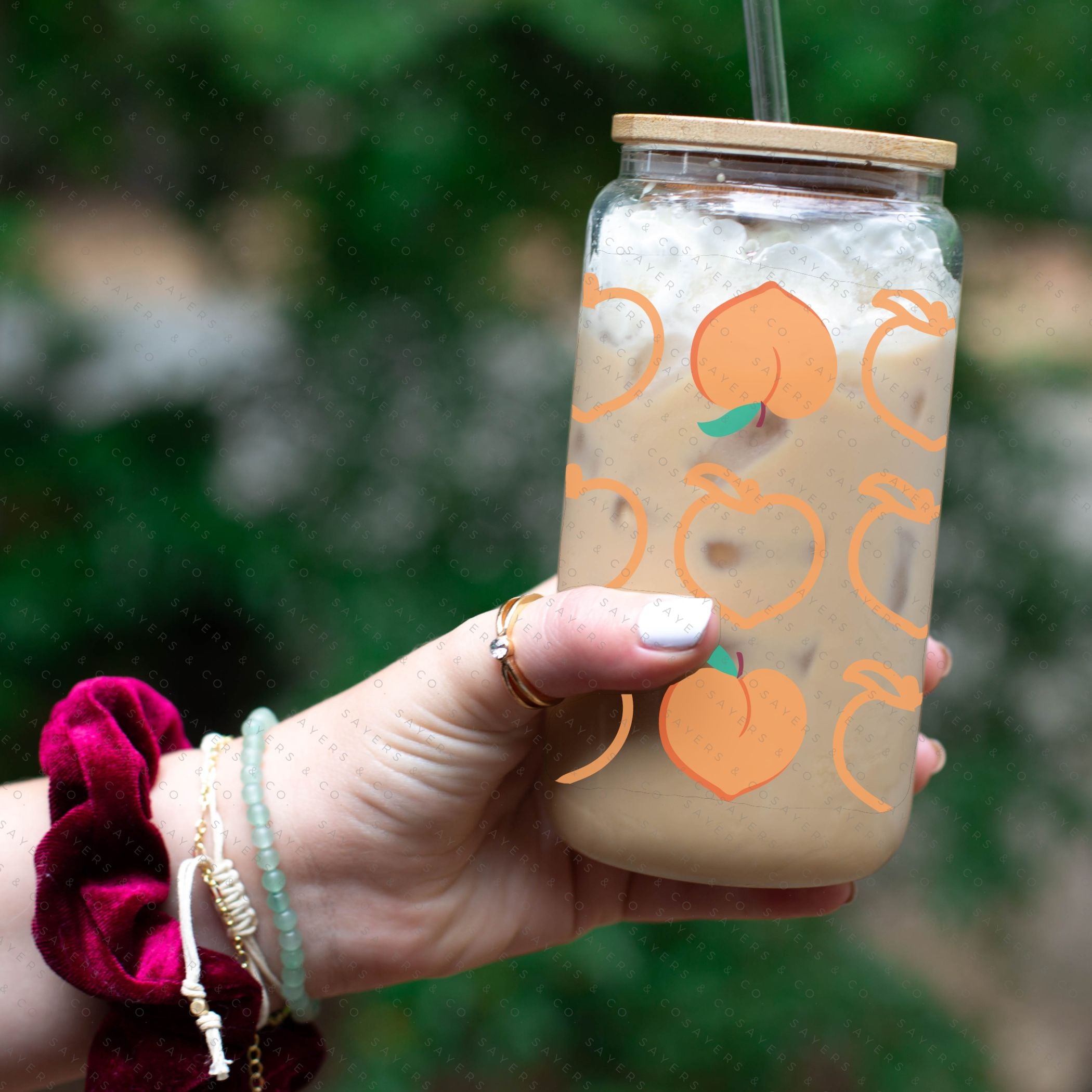 16oz Pretty Peach Glass Cup with Bamboo Lid and Straw, showcasing a vibrant peach design perfect for beverages.