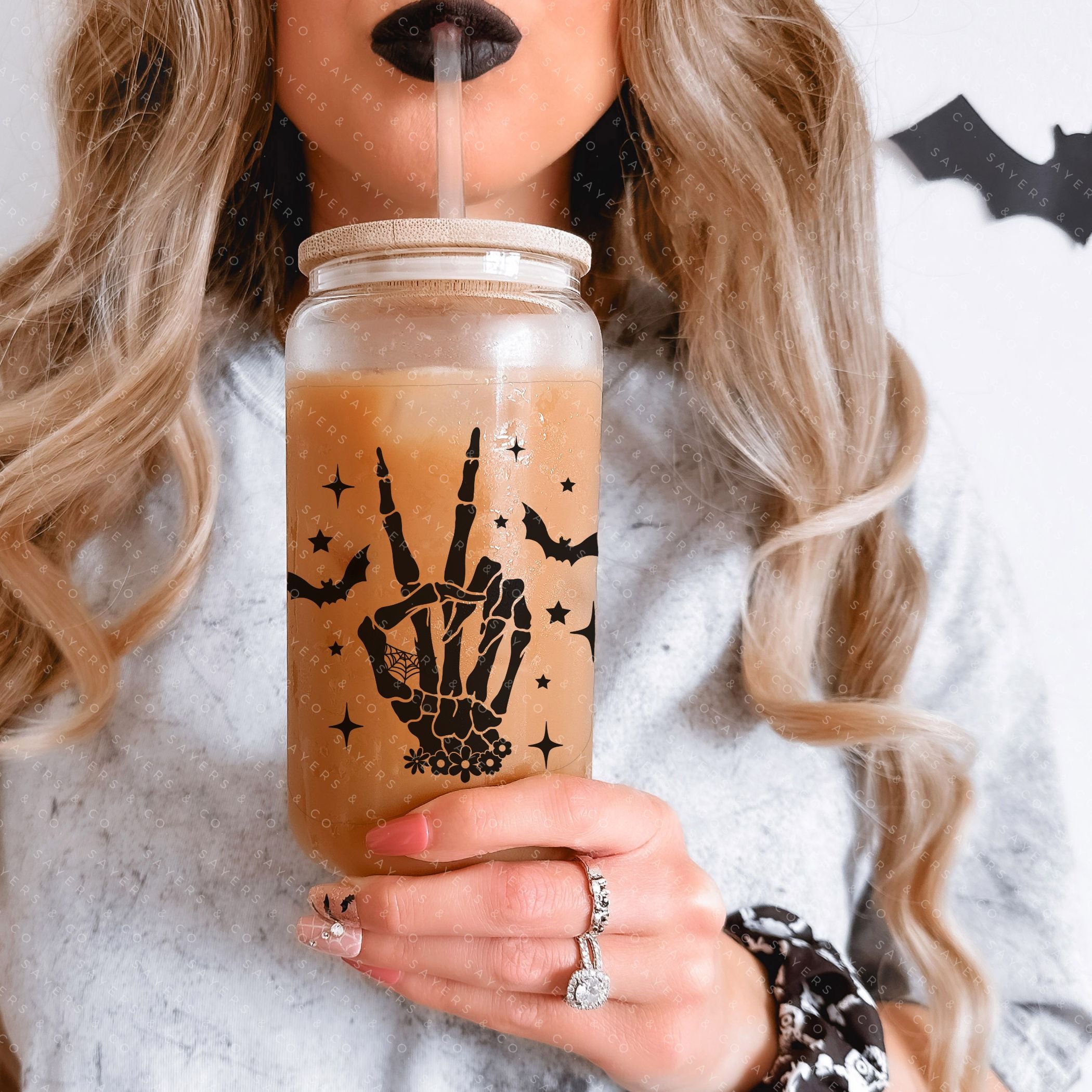 16oz Skeleton Peace Sign Glass Cup featuring a bamboo lid and straw, perfect for Halloween and everyday use.