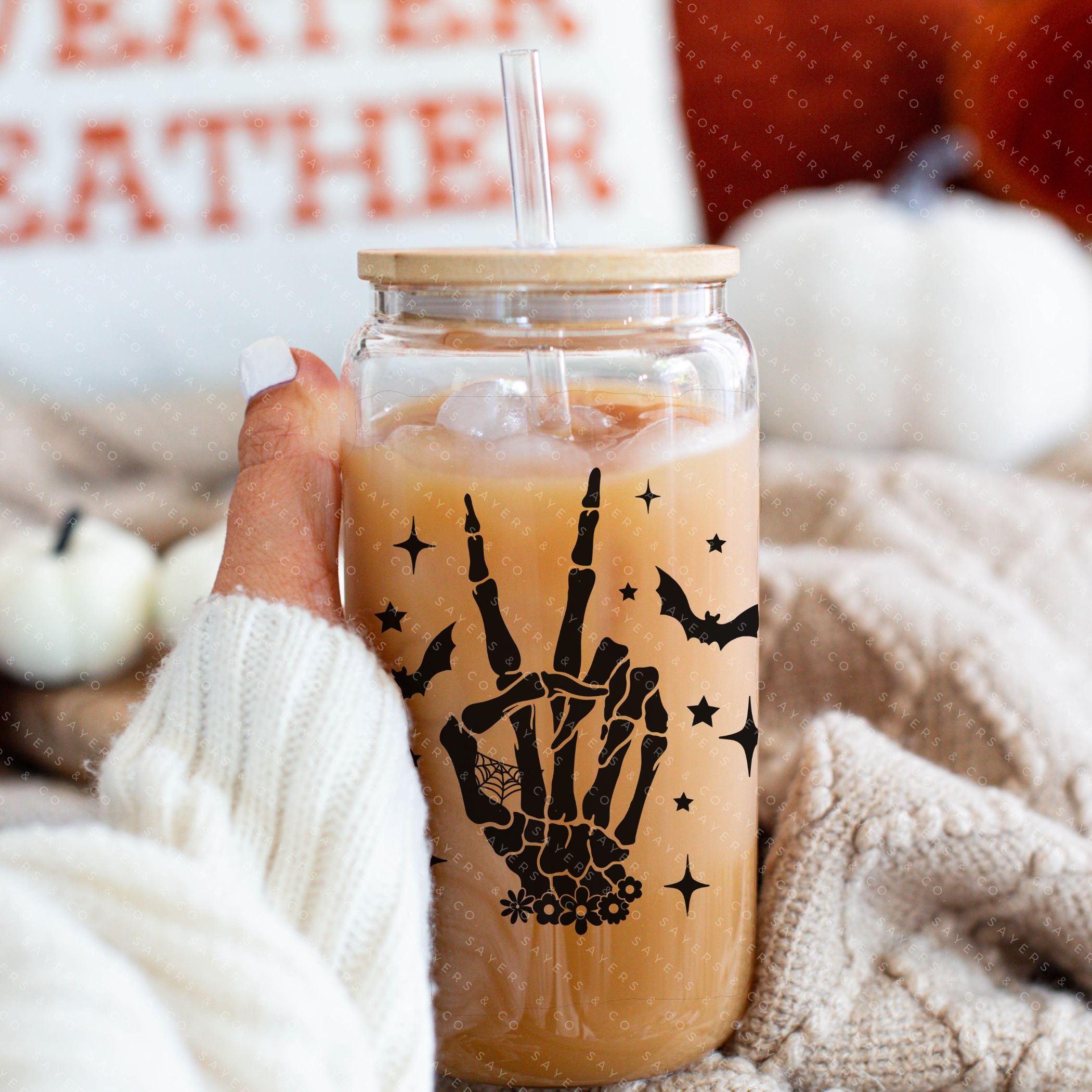 16oz Skeleton Peace Sign Glass Cup featuring a bamboo lid and straw, perfect for Halloween and everyday use.