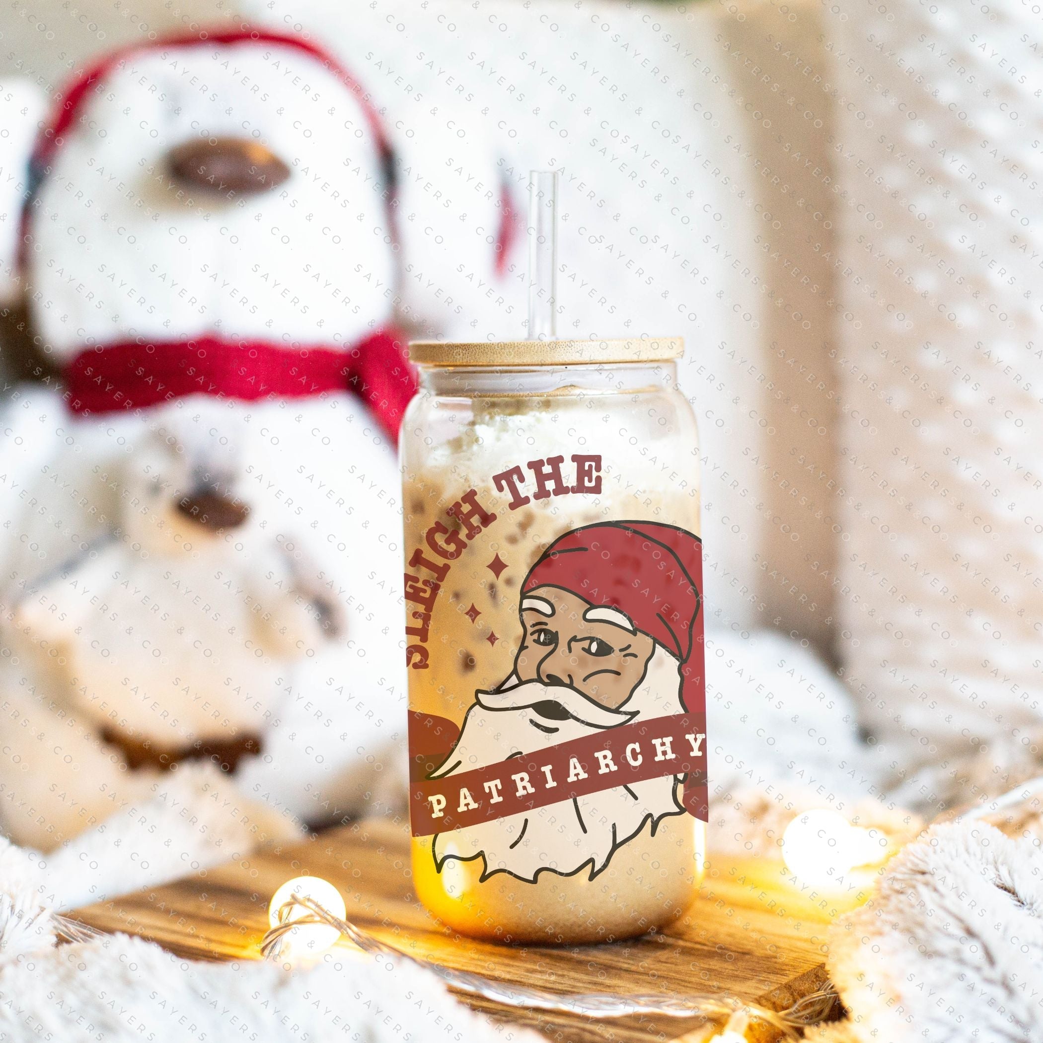 16oz Sleigh The Patriarchy Glass Cup with bamboo lid and straw, showcasing a fun design perfect for beverages.