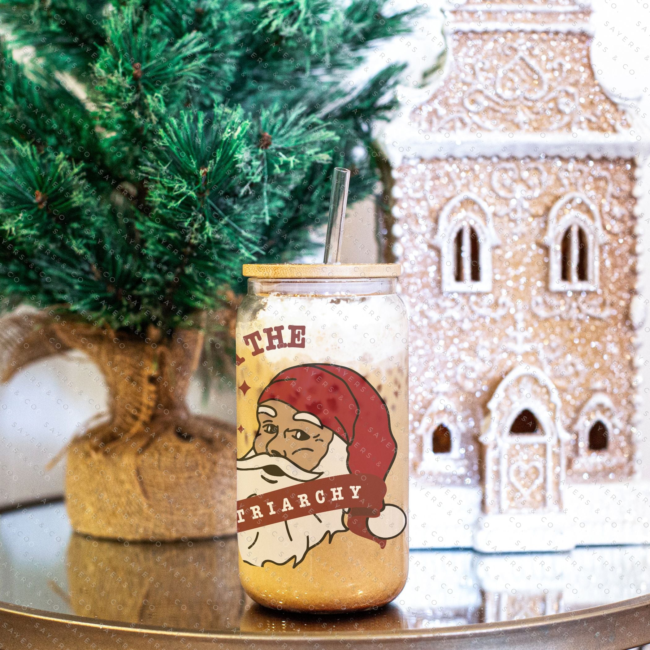 16oz Sleigh The Patriarchy Glass Cup with bamboo lid and straw, showcasing a fun design perfect for beverages.