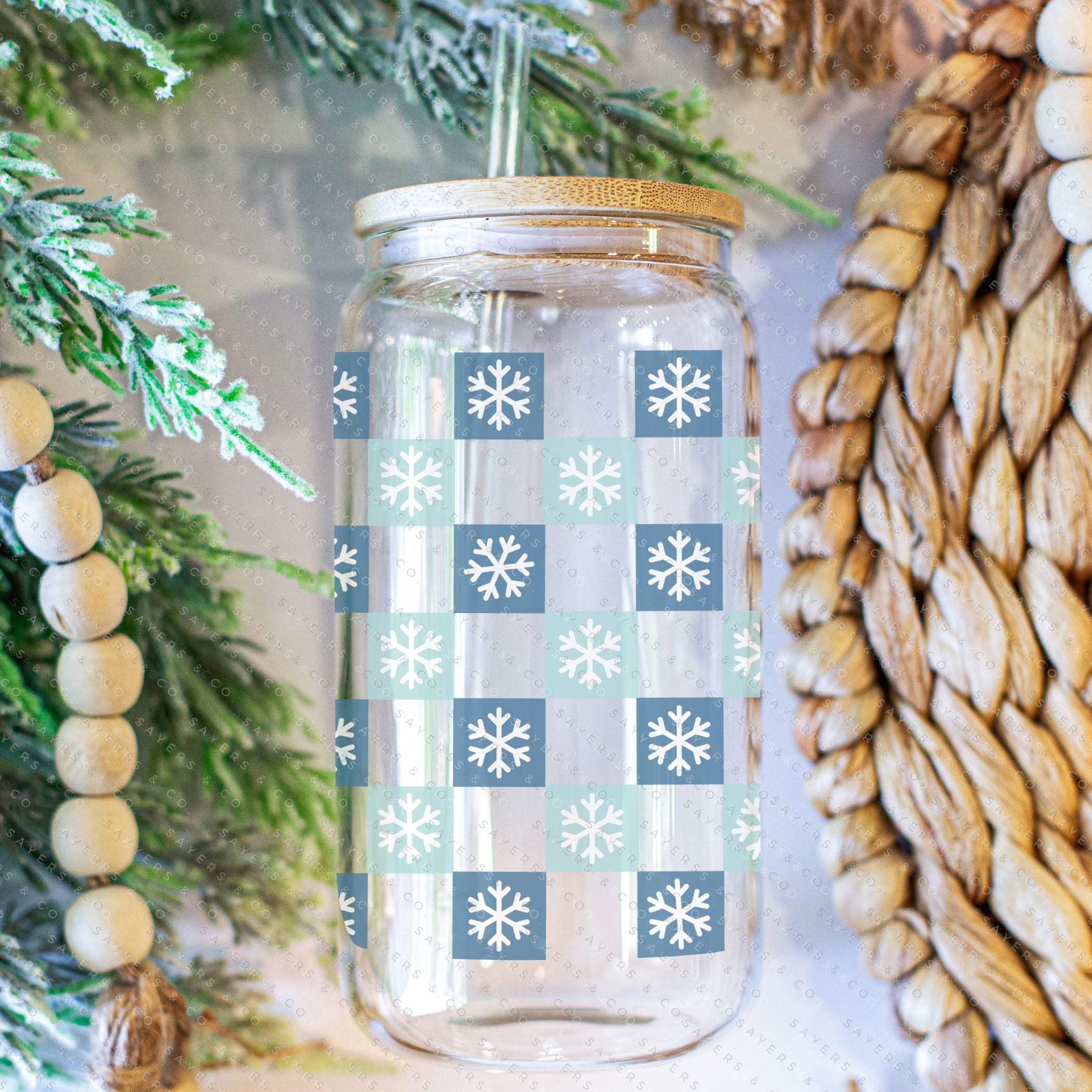 16oz Snowfall Glass Cup with Bamboo Lid and Straw, featuring a winter snowfall design, perfect for hot and cold beverages.