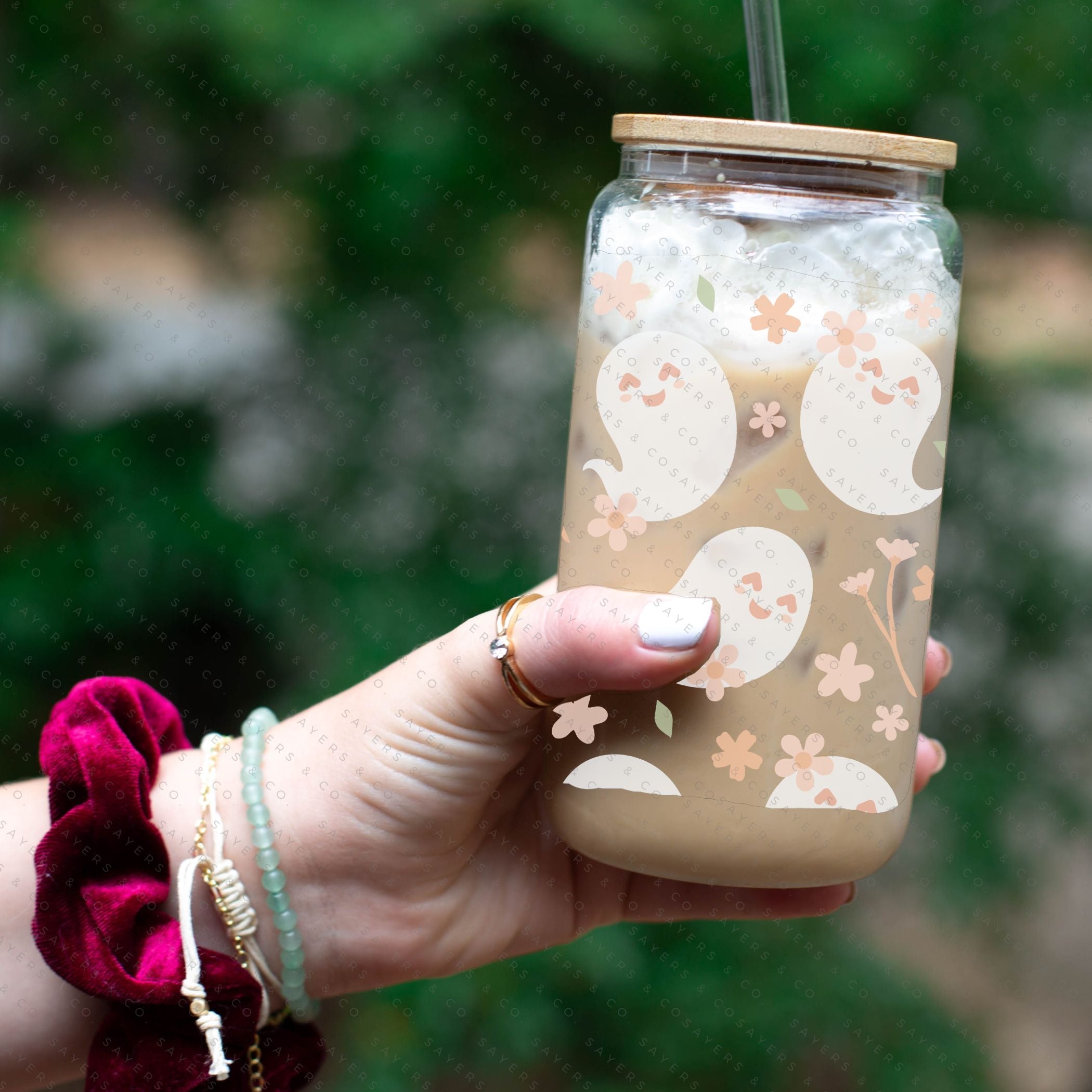16oz Spring Ghosts Glass Cup with Bamboo Lid and Straw, featuring a whimsical spring design perfect for various beverages.