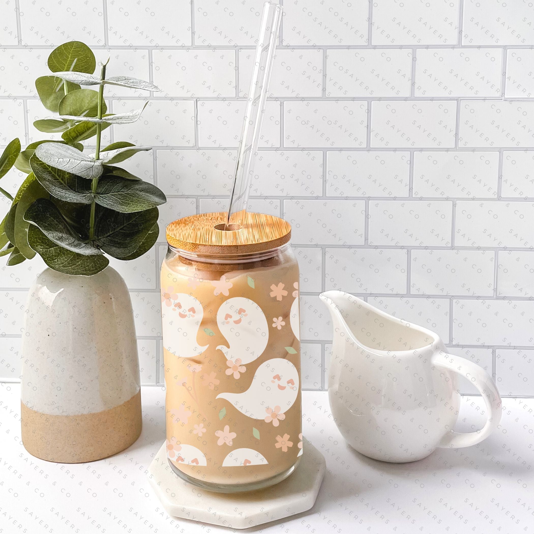 16oz Spring Ghosts Glass Cup with Bamboo Lid and Straw, featuring a whimsical spring design perfect for various beverages.