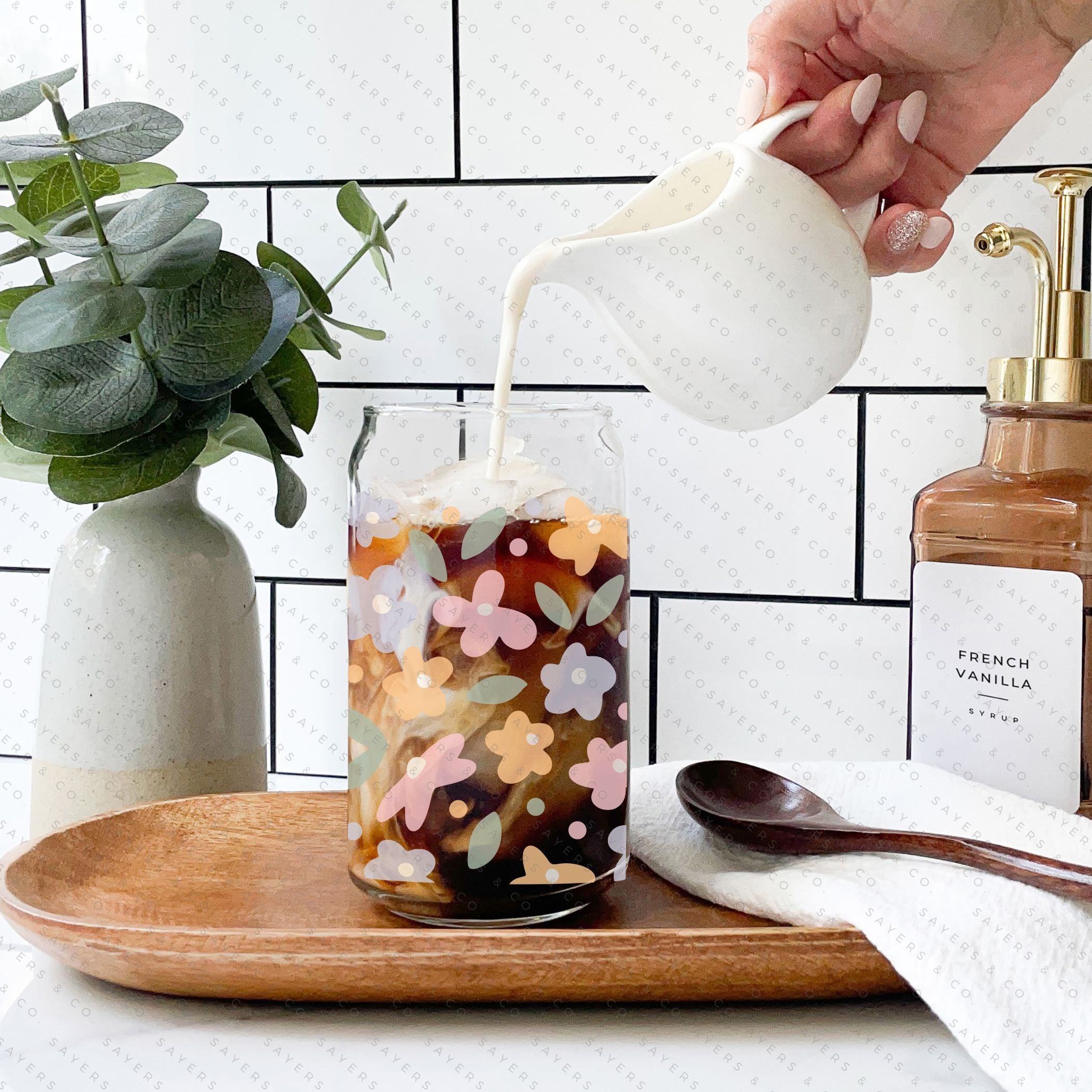 16oz Spring Pastel Petals Glass Cup featuring a bamboo lid and straw, adorned with colorful floral designs, perfect for beverages.