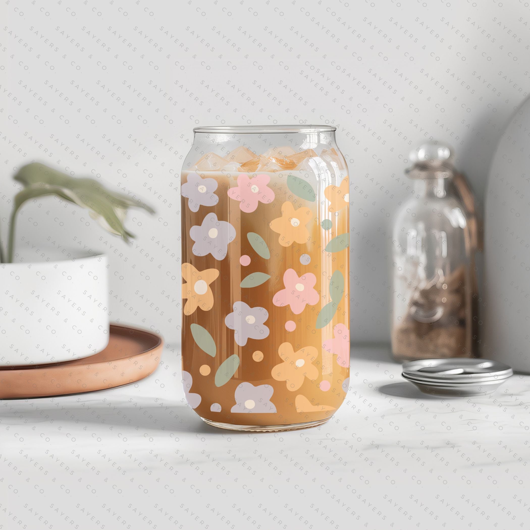 16oz Spring Pastel Petals Glass Cup featuring a bamboo lid and straw, adorned with colorful floral designs, perfect for beverages.