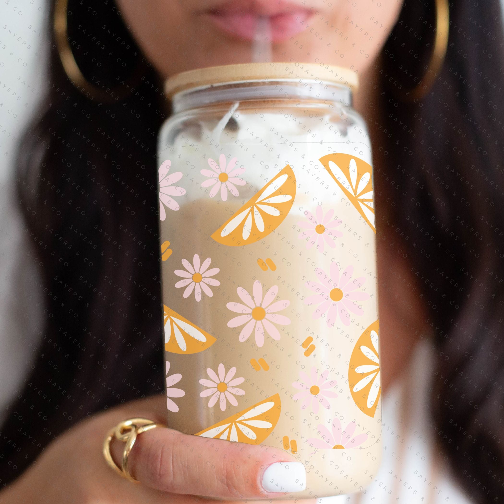 16oz Spring Squeeze The Day Glass Cup with bamboo lid and straw, showcasing a vibrant floral design perfect for spring.