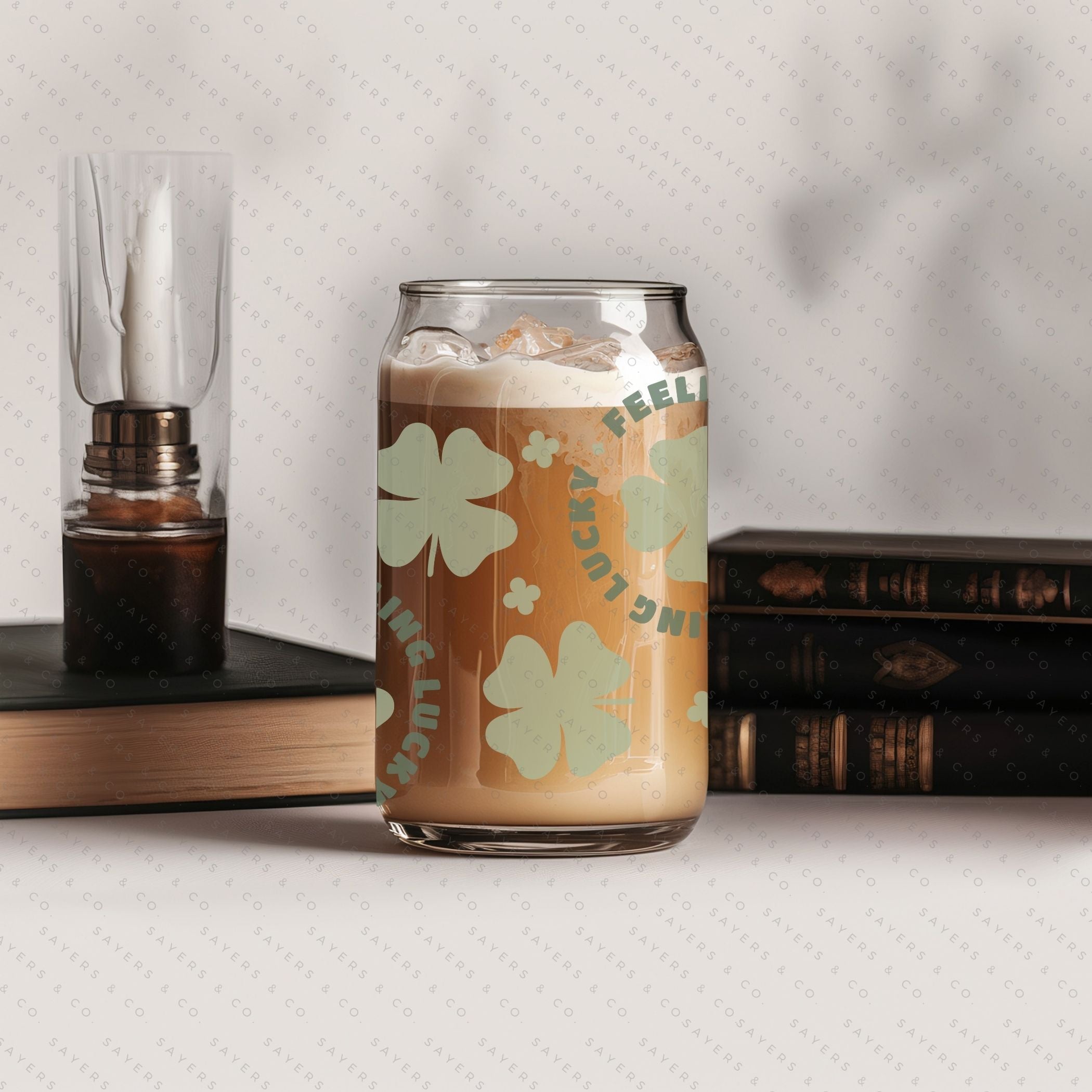 16oz St. Patrick's Day Feeling Lucky Shamrock Glass Cup featuring a bamboo lid and straw, perfect for festive drinks.