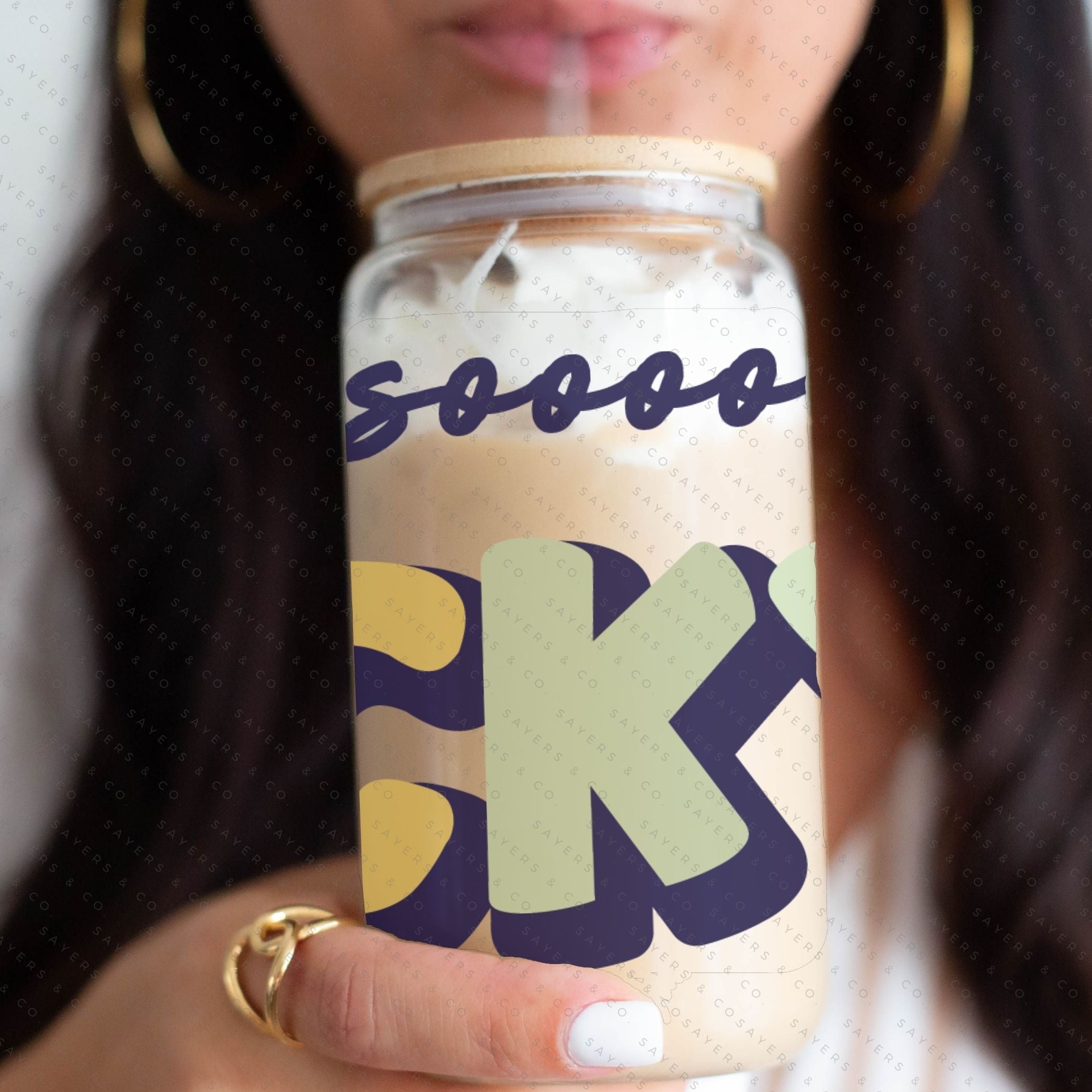 16oz St. Patrick's Day glass cup with bamboo lid and straw, featuring a fun 'I Am So Lucky' design, perfect for festive drinks.