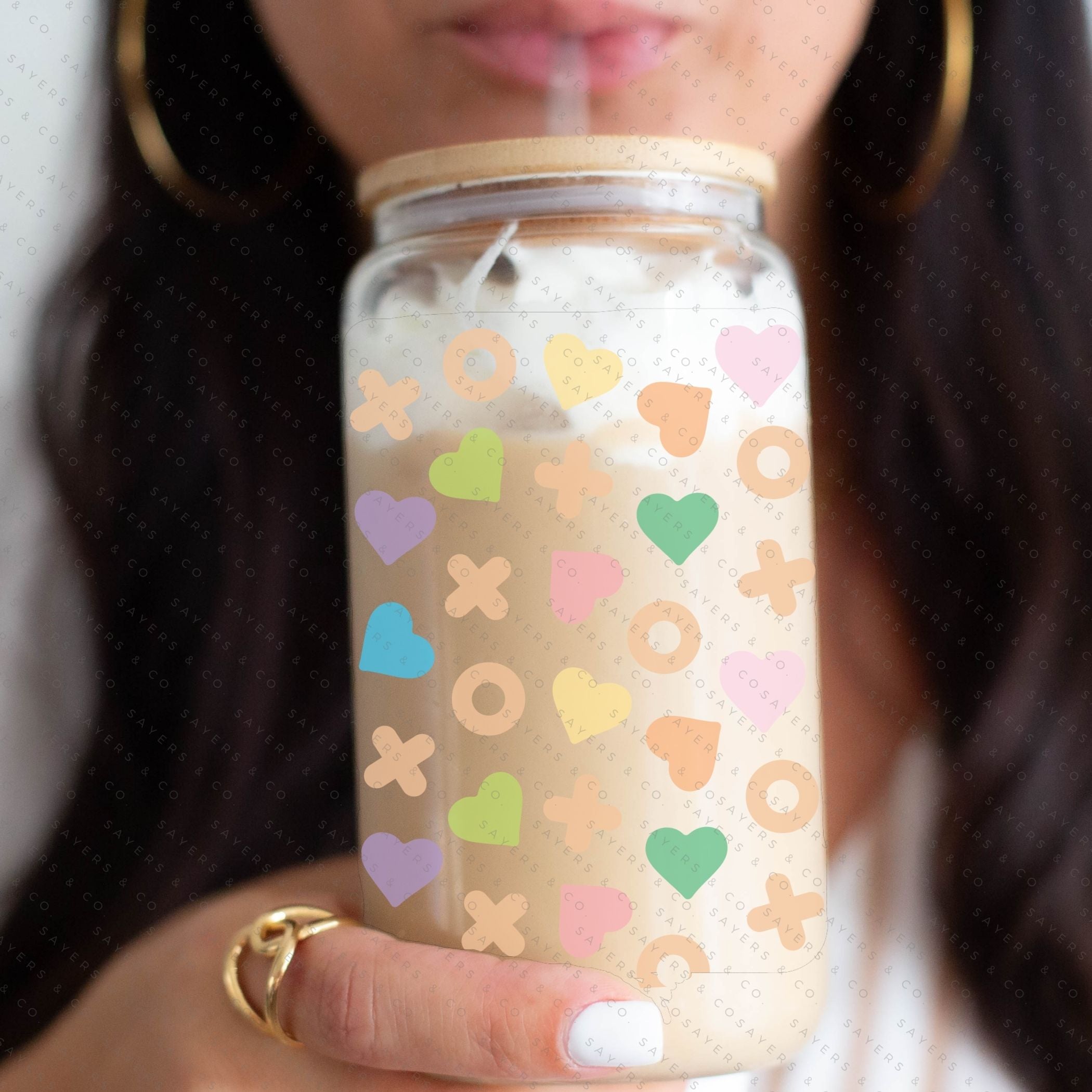 16oz St. Patrick's Day Lucky Sharms Irish Glass Cup featuring a bamboo lid and straw, perfect for festive drinks.