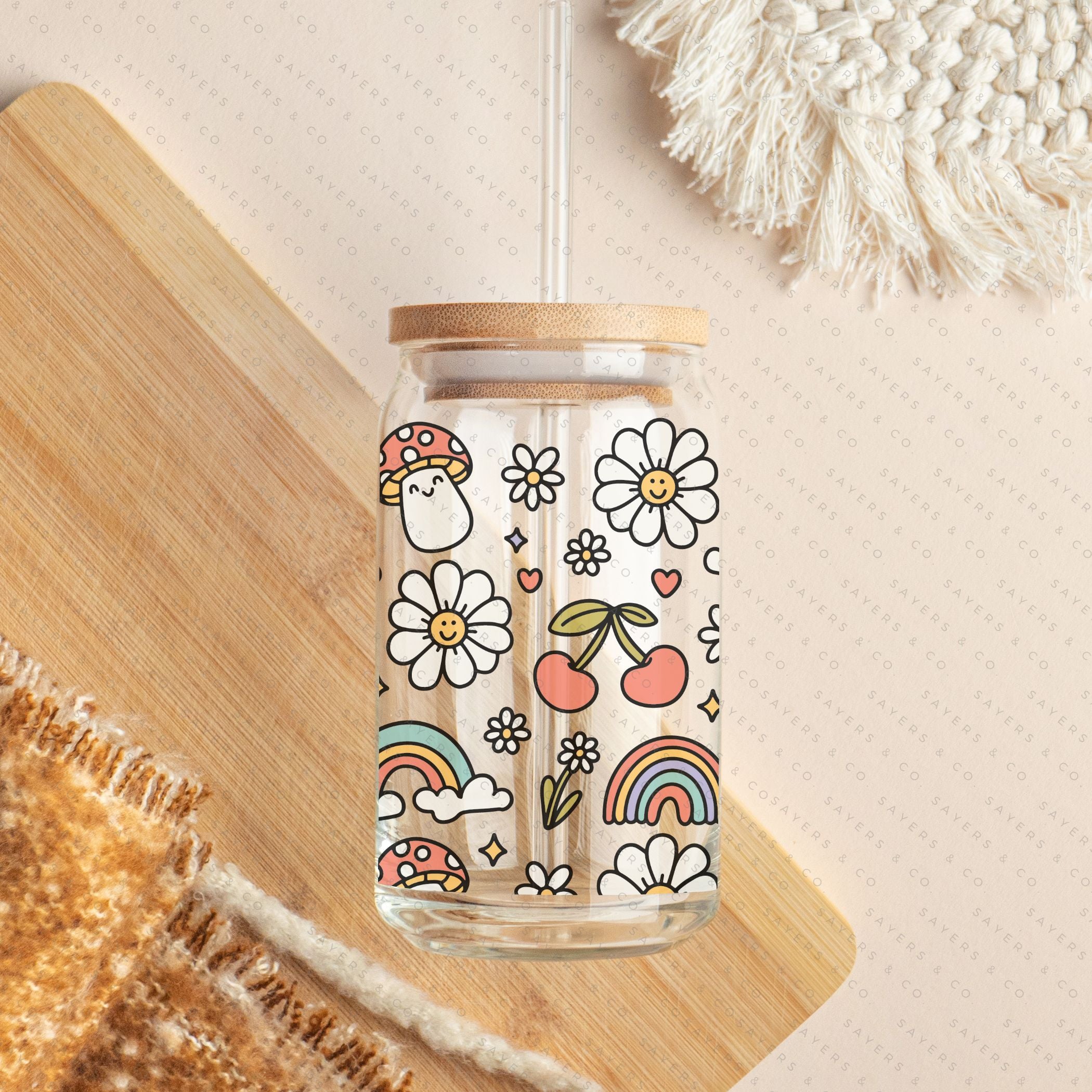 16oz Summer Groovy Glass Cup with Bamboo Lid and Straw, showcasing a colorful design perfect for summer drinks.