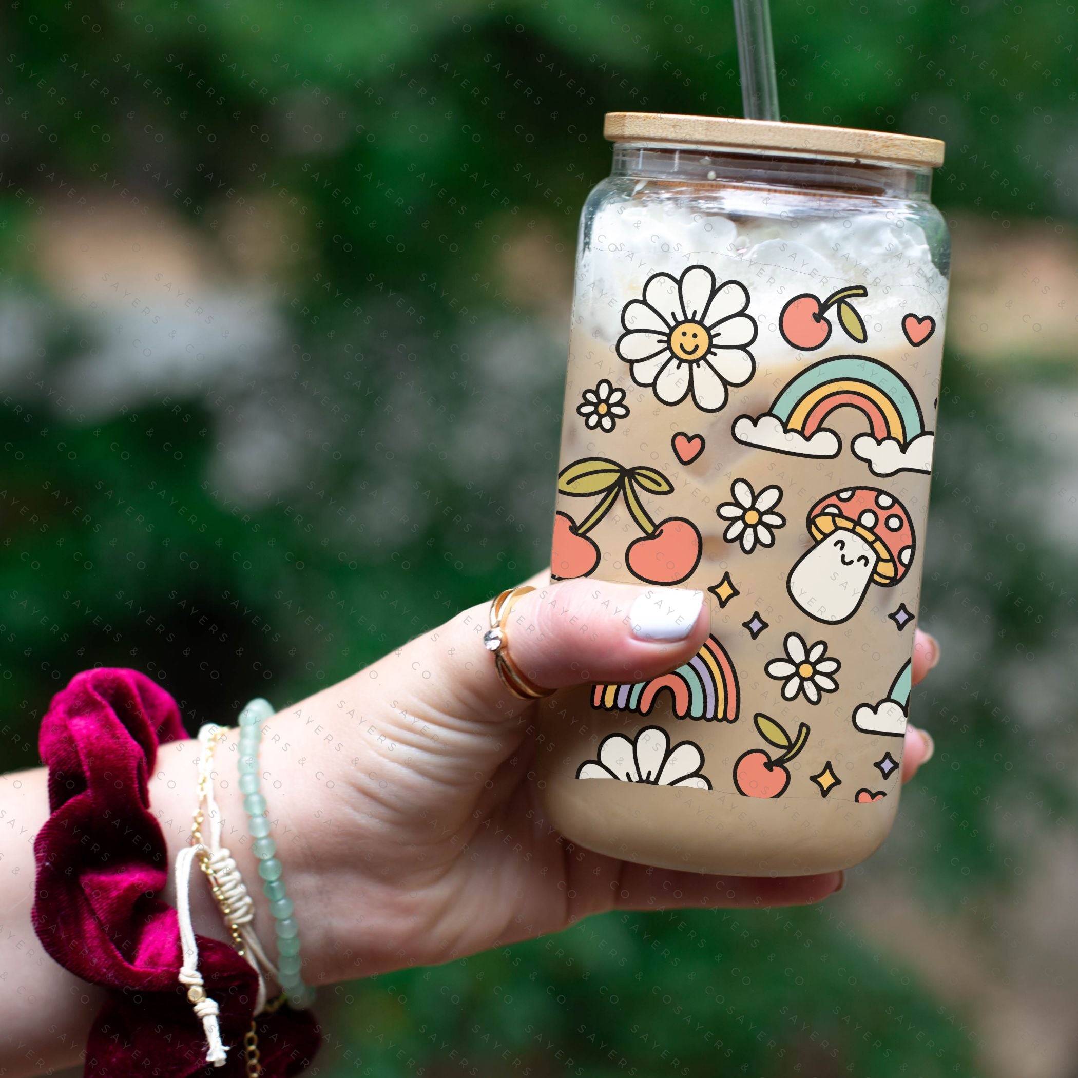 16oz Summer Groovy Glass Cup with Bamboo Lid and Straw, showcasing a colorful design perfect for summer drinks.