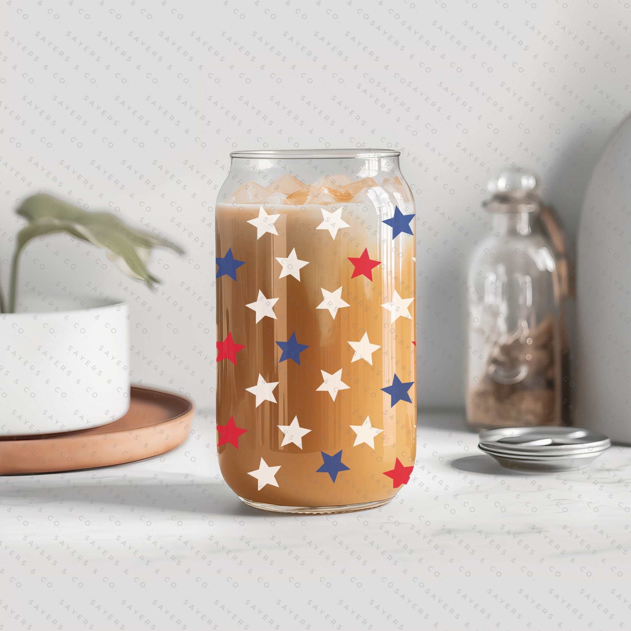 16oz Summer USA Super Stars Patriotic Glass Cup with bamboo lid and straw, featuring a vibrant red, white, and blue design.