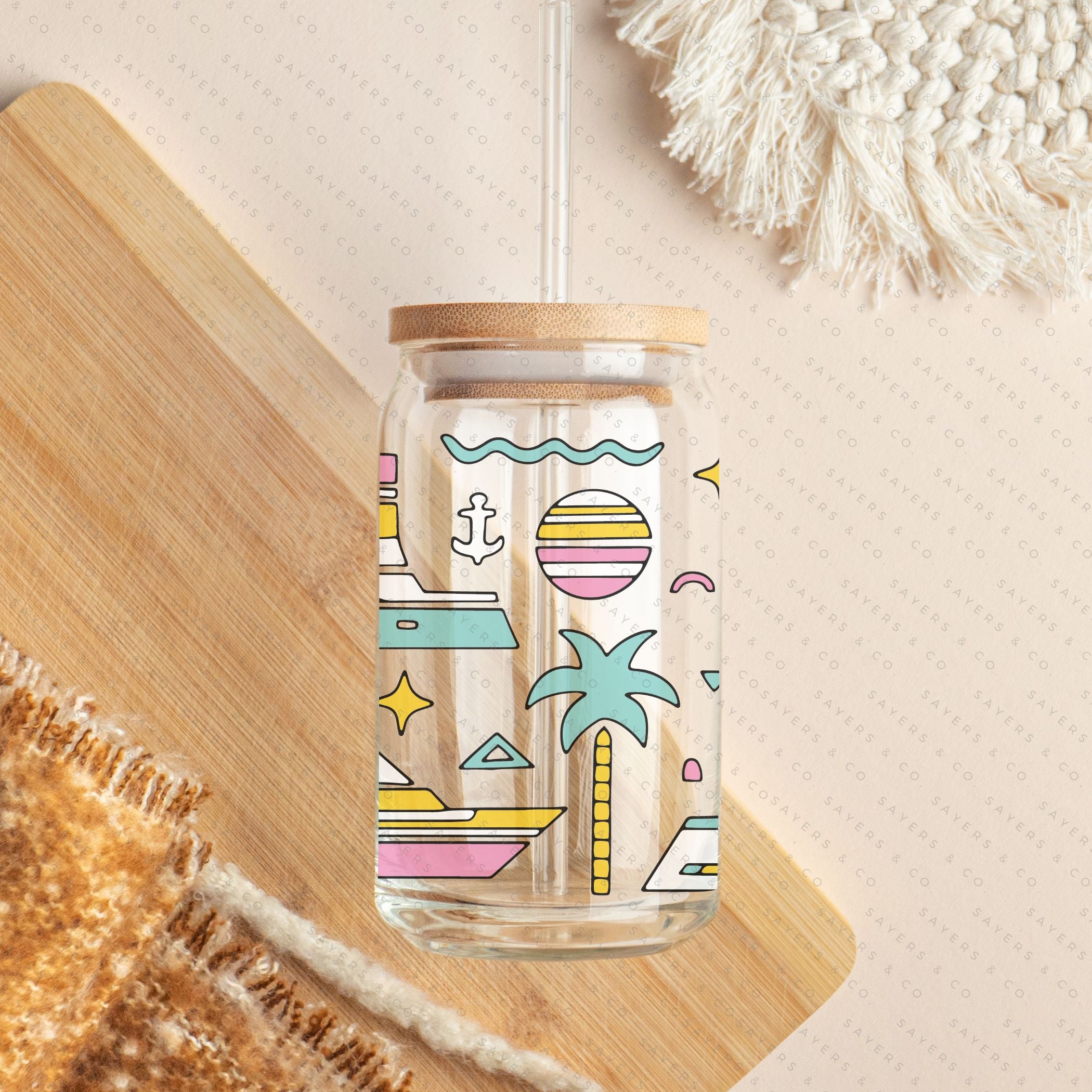 16oz Summer Yachty By Nature Glass Cup with bamboo lid and straw, featuring a colorful palm tree design, perfect for summer beverages.