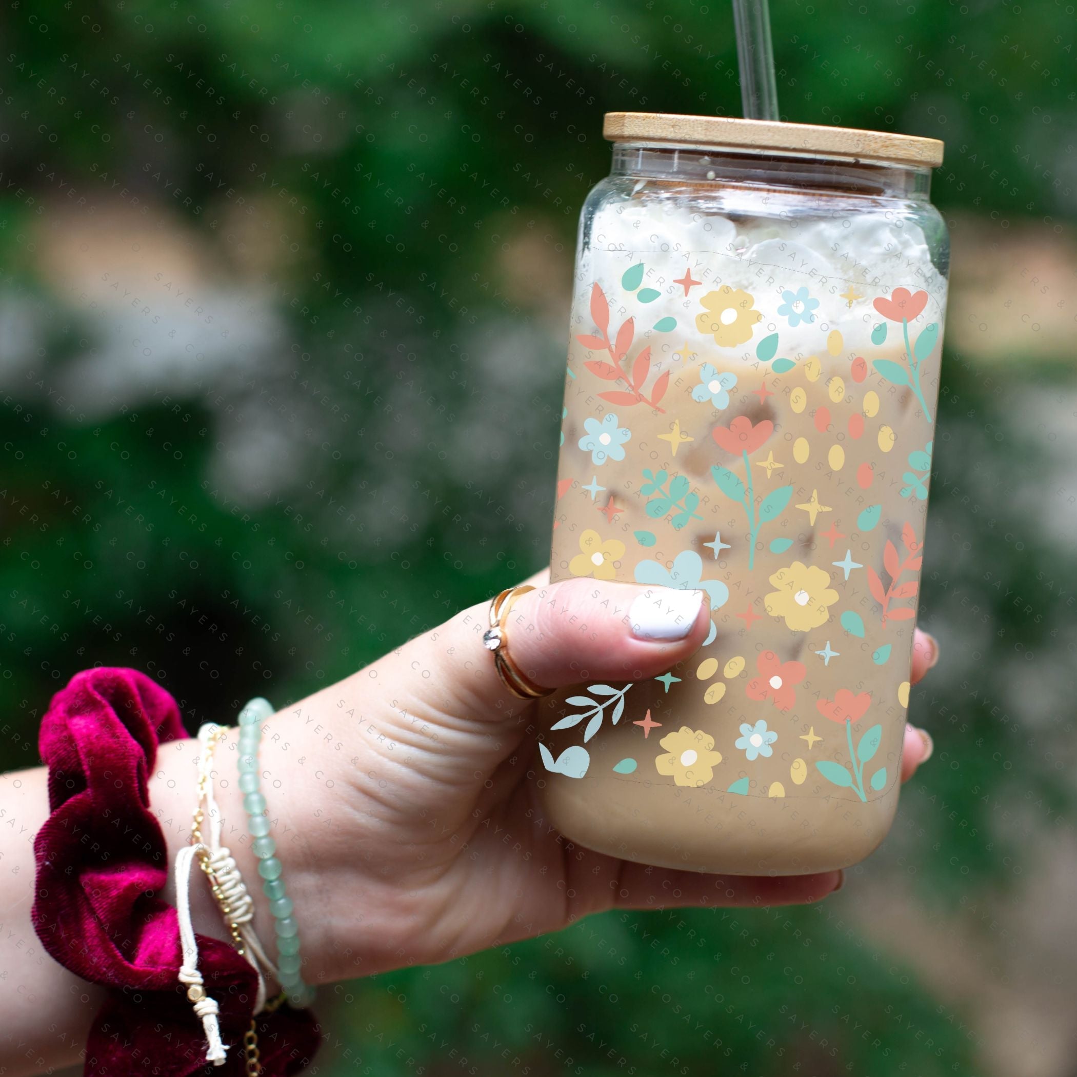 16oz Sweet Spring Glass Cup featuring a bamboo lid and straw, adorned with a floral design, perfect for beverages.
