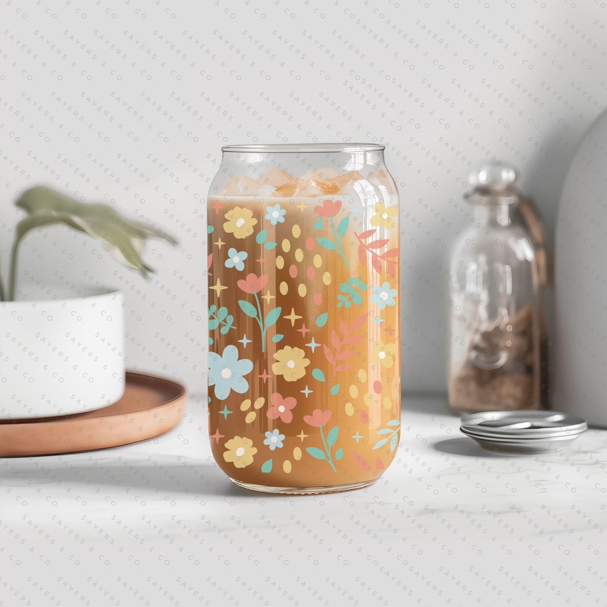 16oz Sweet Spring Glass Cup featuring a bamboo lid and straw, adorned with a floral design, perfect for beverages.