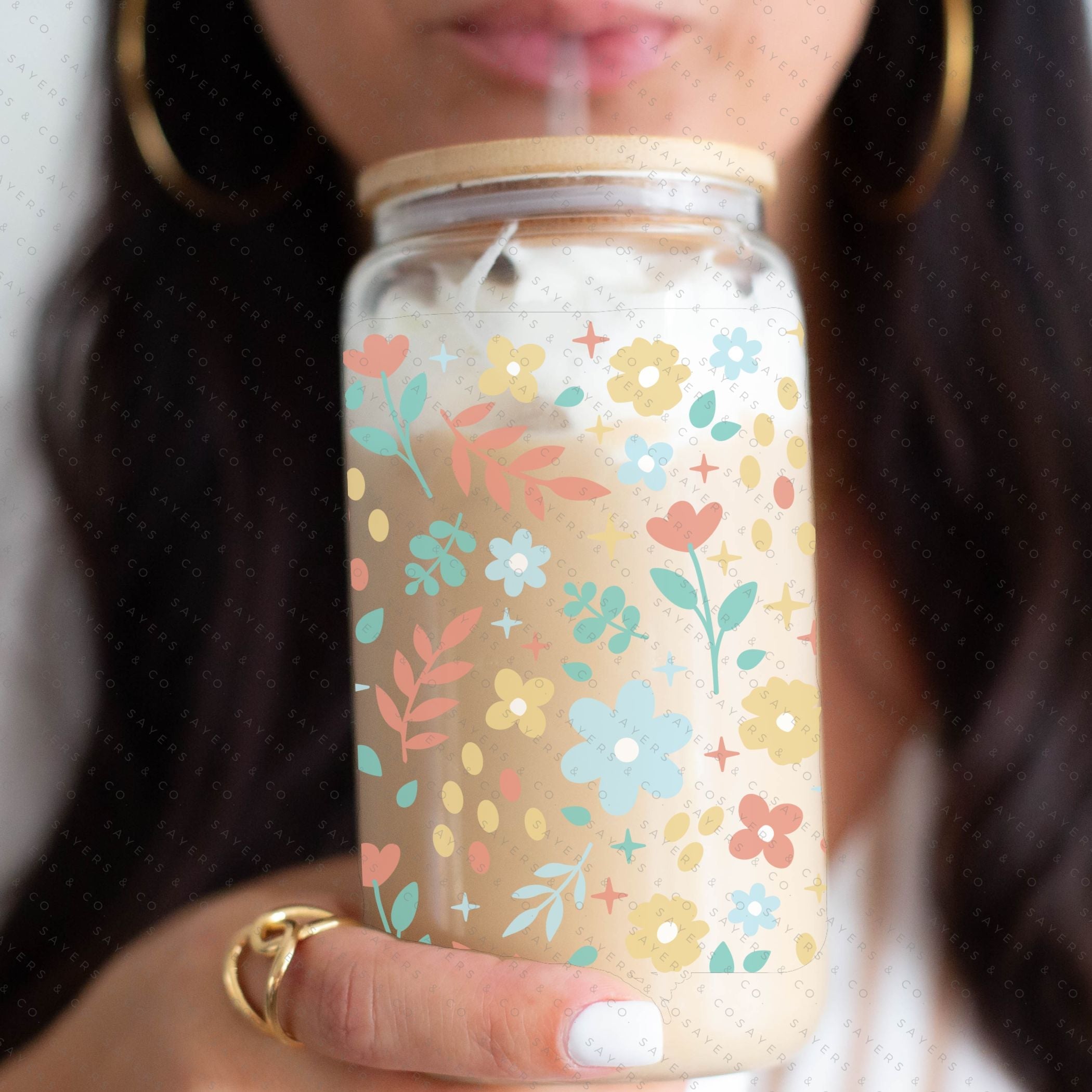 16oz Sweet Spring Glass Cup featuring a bamboo lid and straw, adorned with a floral design, perfect for beverages.