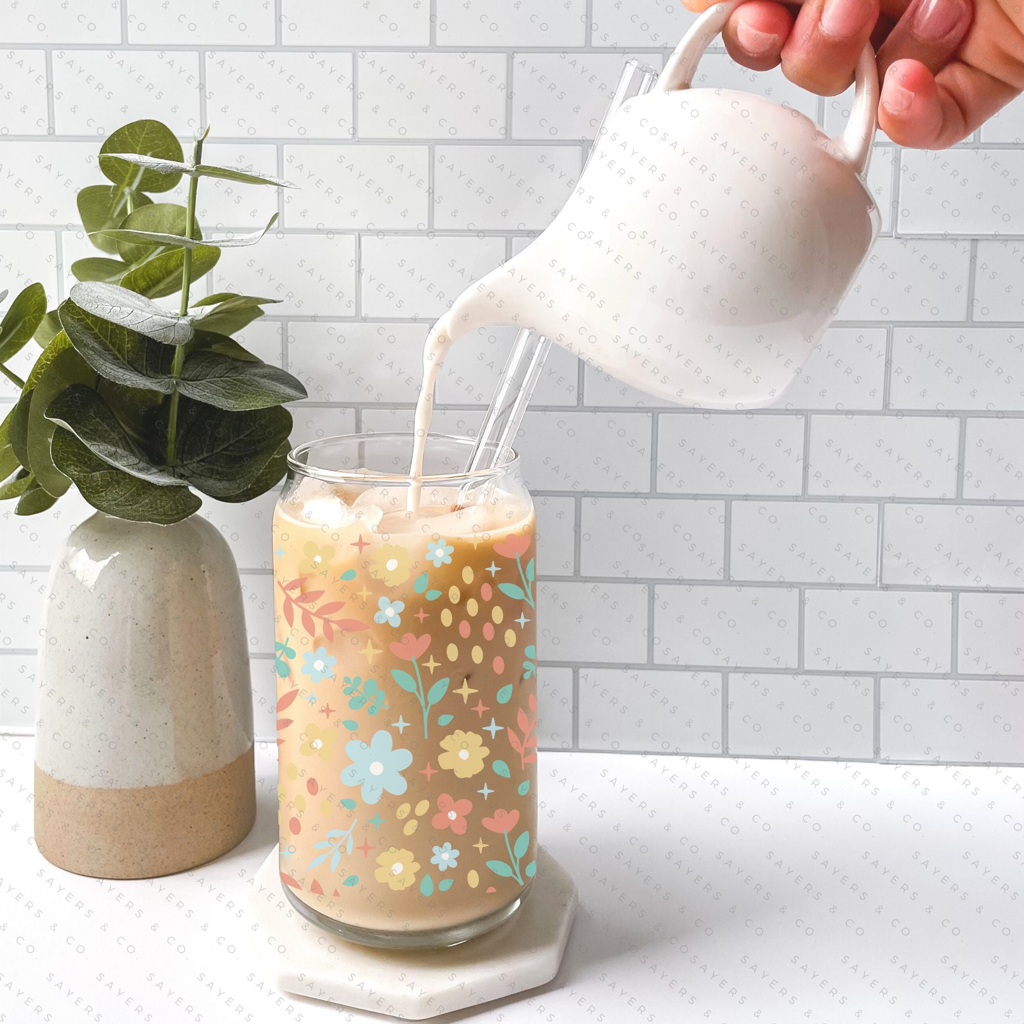 16oz Sweet Spring Glass Cup featuring a bamboo lid and straw, adorned with a floral design, perfect for beverages.