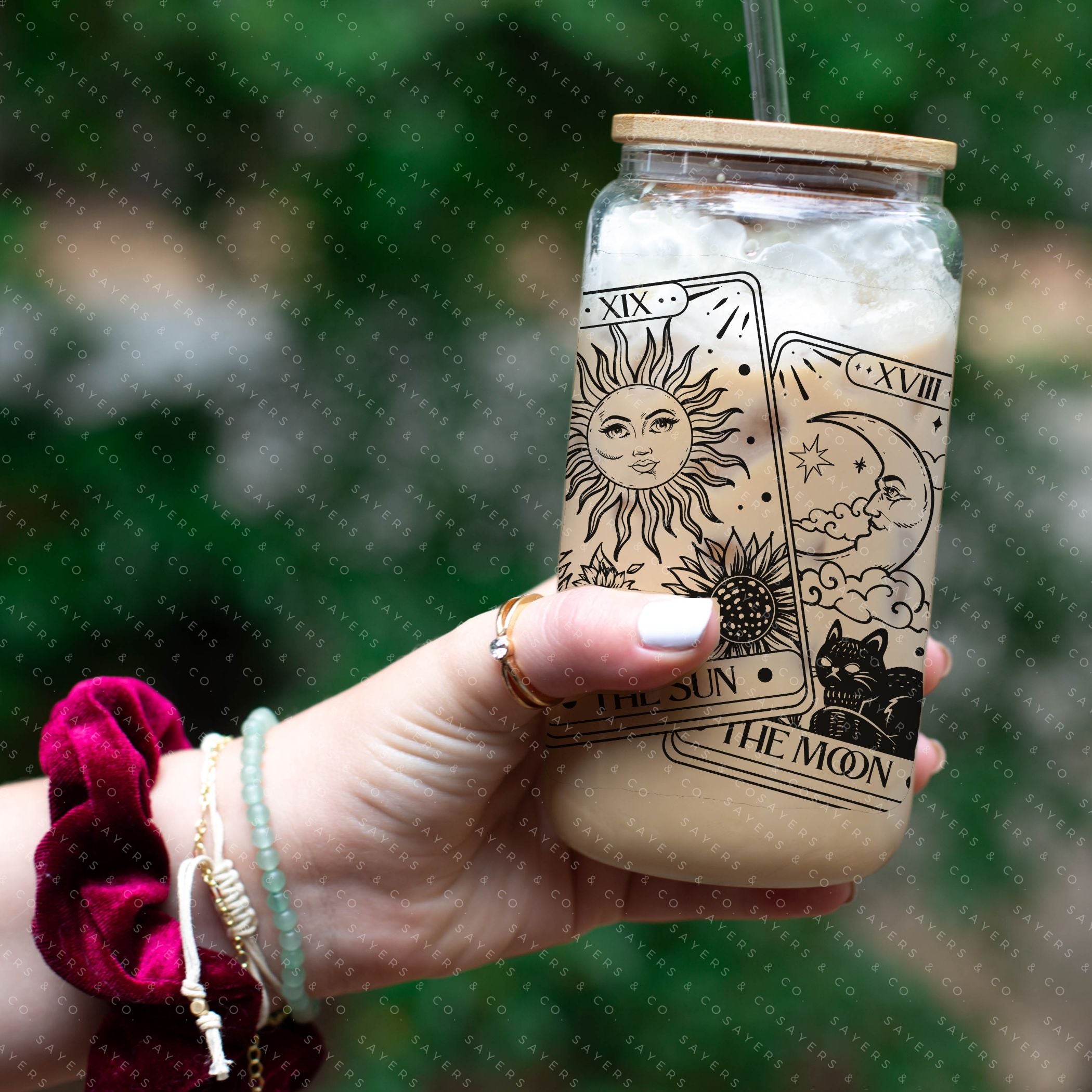 16oz Tarot Cards Sun and Moon Glass Cup featuring a bamboo lid and straw, perfect for various beverages.