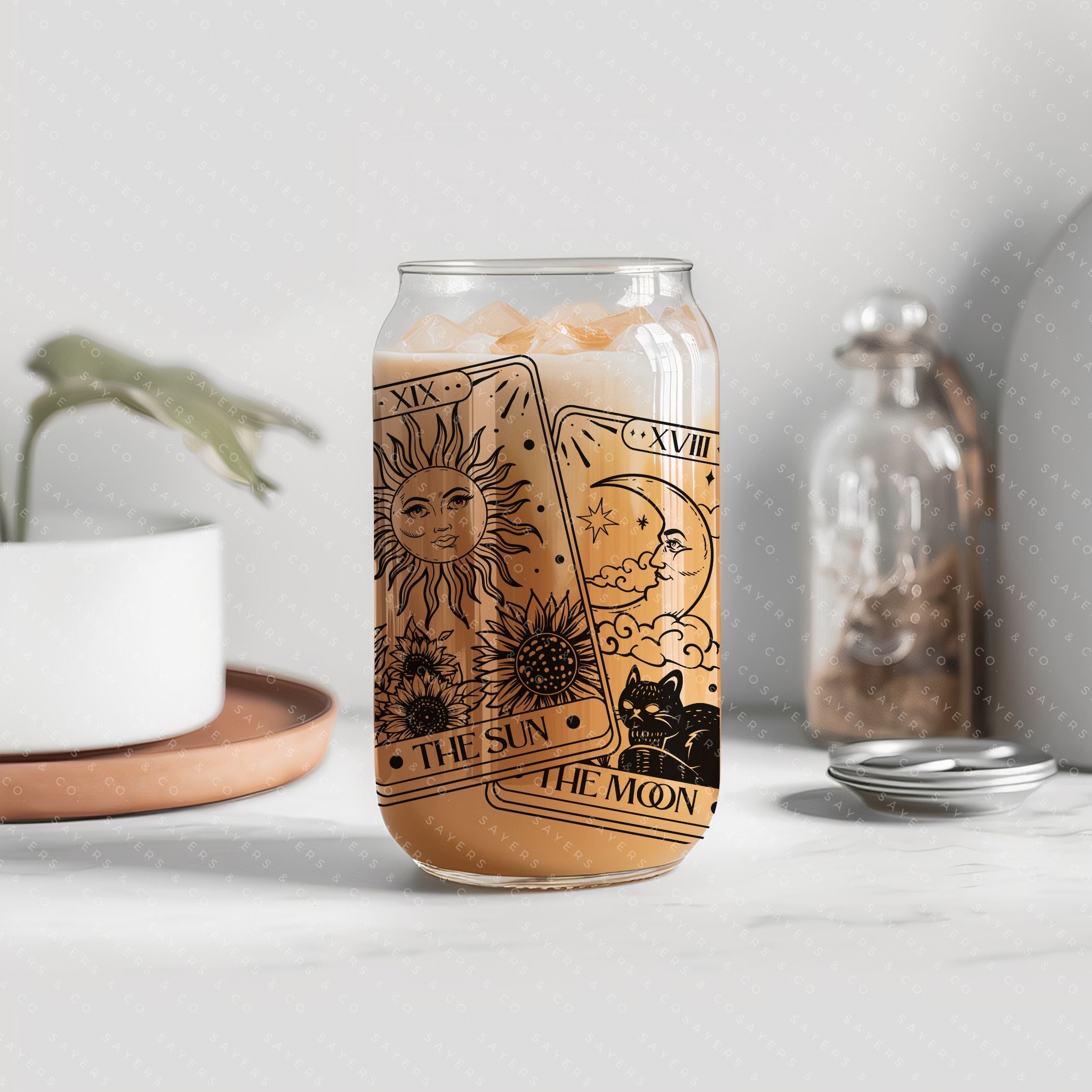 16oz Tarot Cards Sun and Moon Glass Cup featuring a bamboo lid and straw, perfect for various beverages.