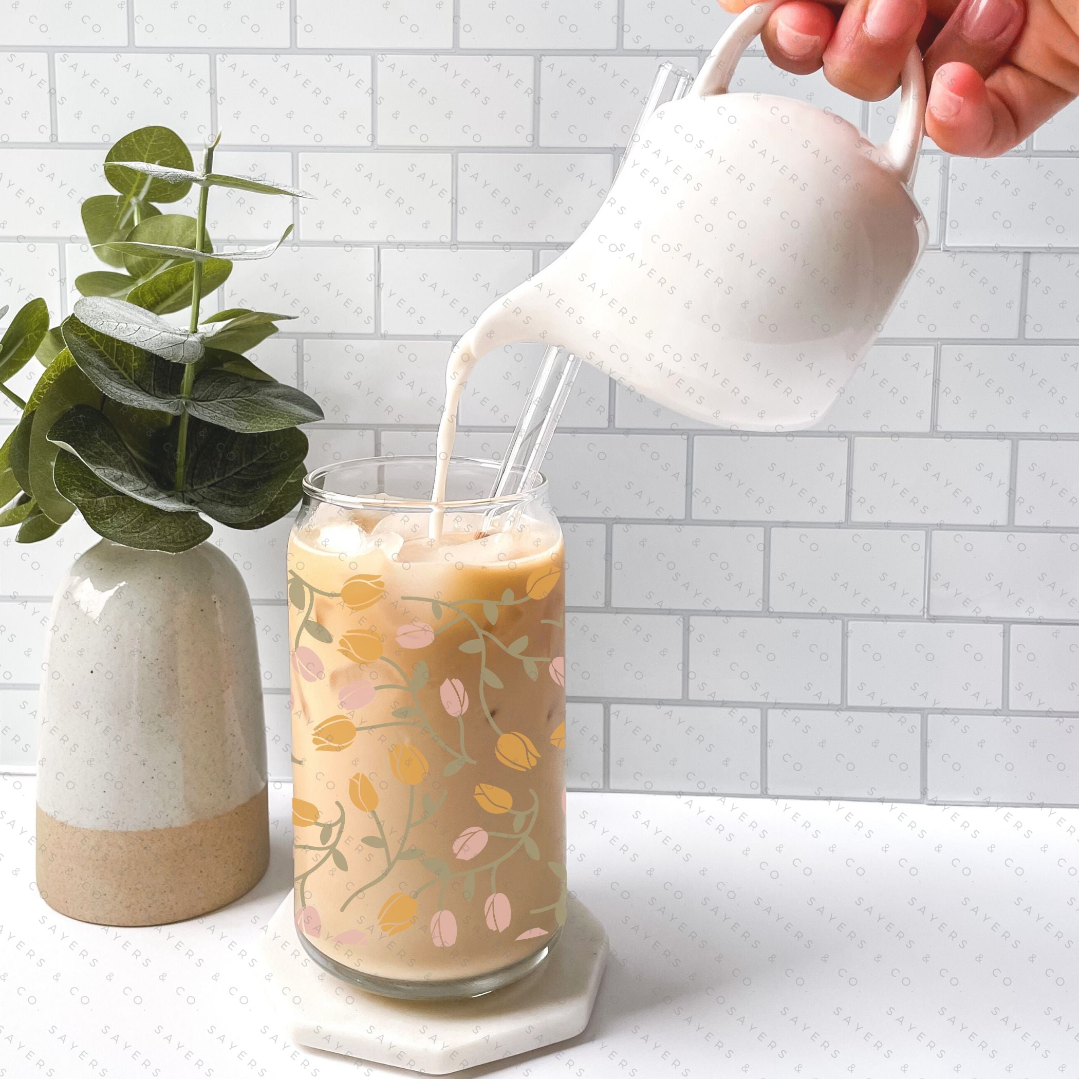 16oz Tulip Entanglement Glass Cup with bamboo lid and straw, featuring a floral design, perfect for beverages.