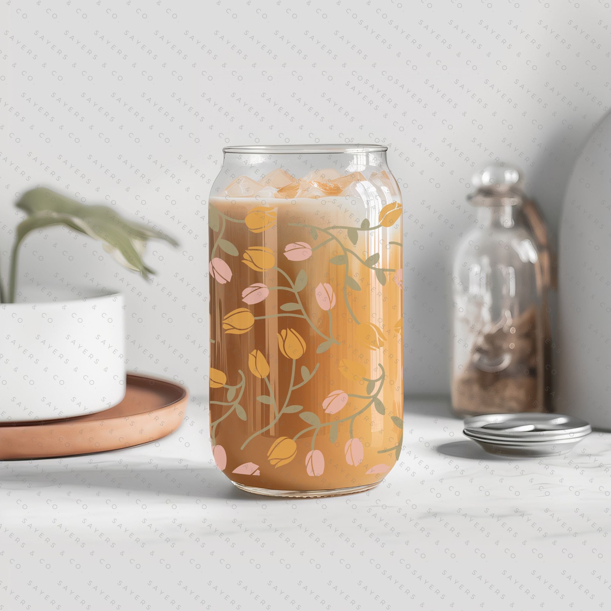 16oz Tulip Entanglement Glass Cup with bamboo lid and straw, featuring a floral design, perfect for beverages.