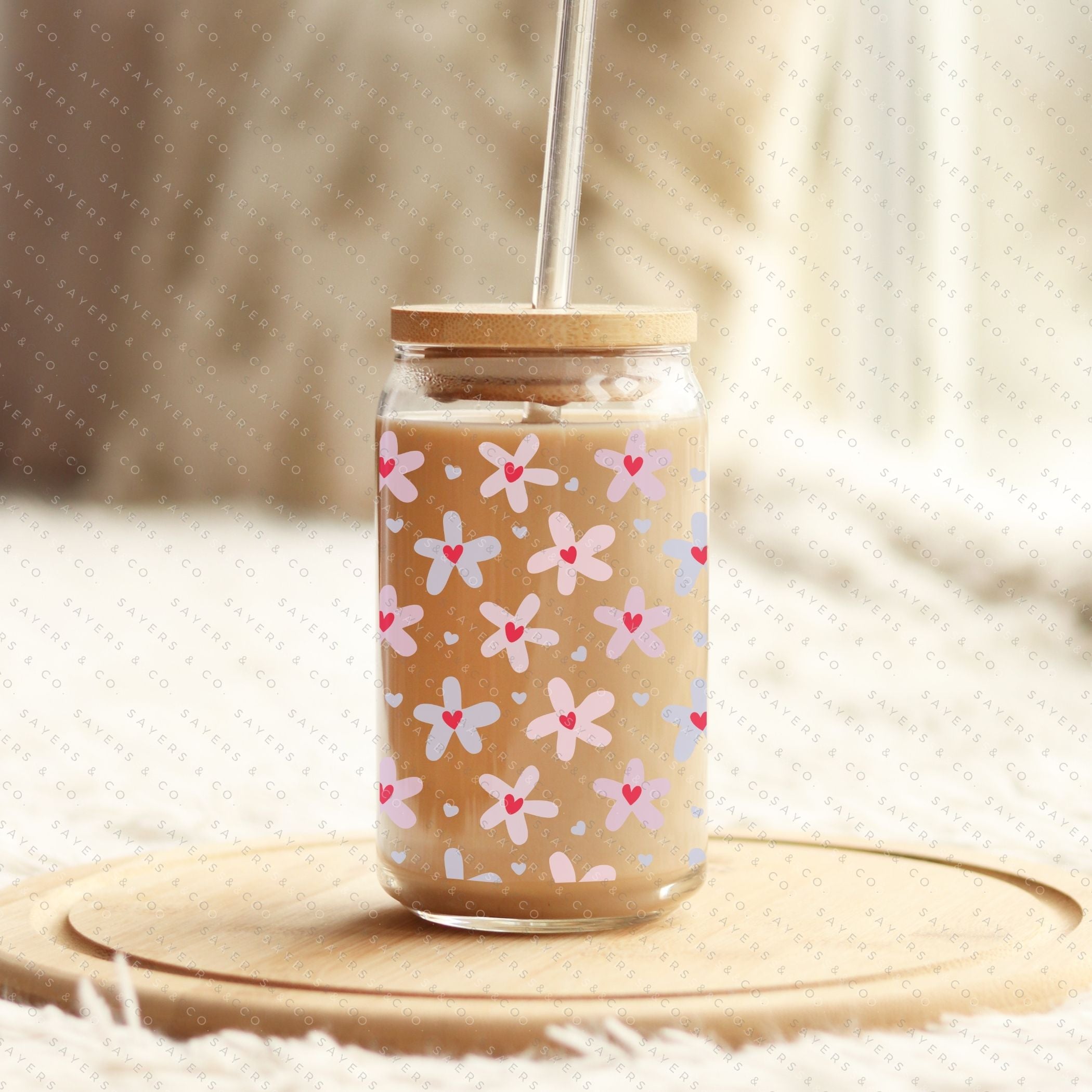 16oz Valentine's Day Daisy Hearts Glass Cup featuring a bamboo lid and straw, showcasing a floral design perfect for gifting.
