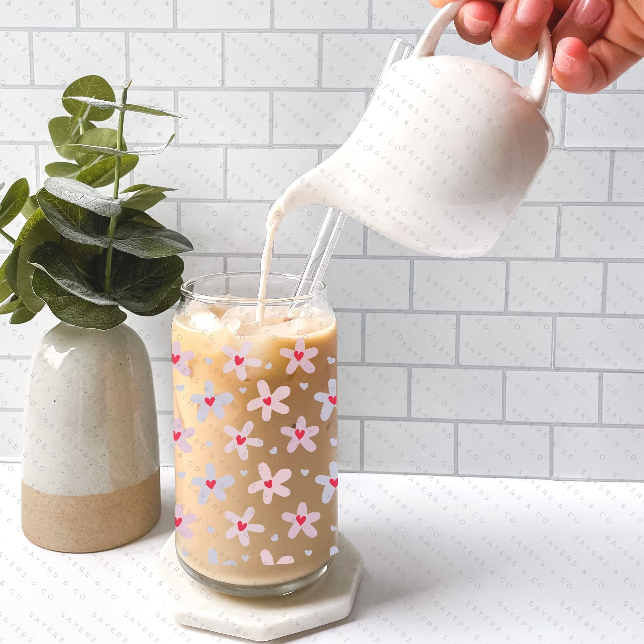 16oz Valentine's Day Daisy Hearts Glass Cup featuring a bamboo lid and straw, showcasing a floral design perfect for gifting.