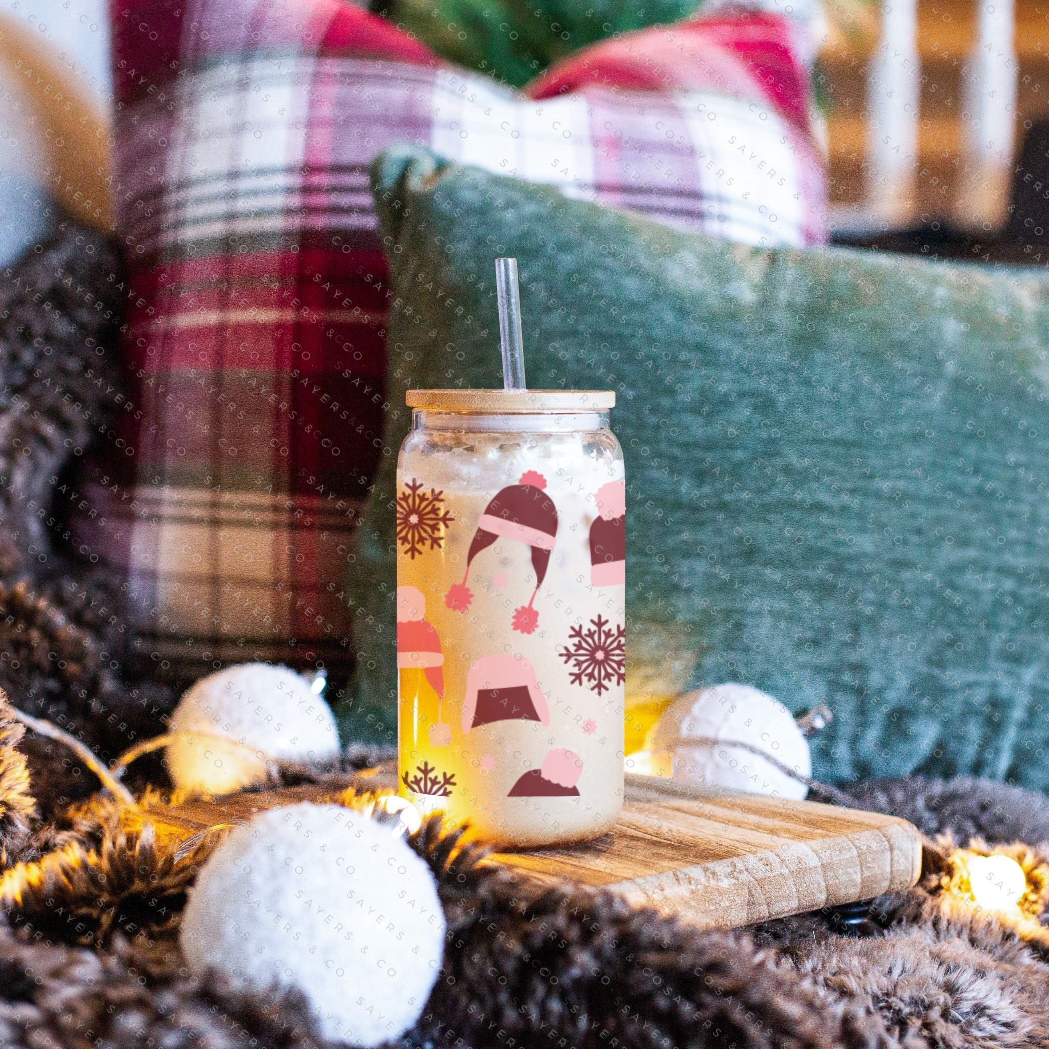 16oz Winter Beanies Glass Cup with bamboo lid and straw, featuring a festive winter design, perfect for holiday drinks.