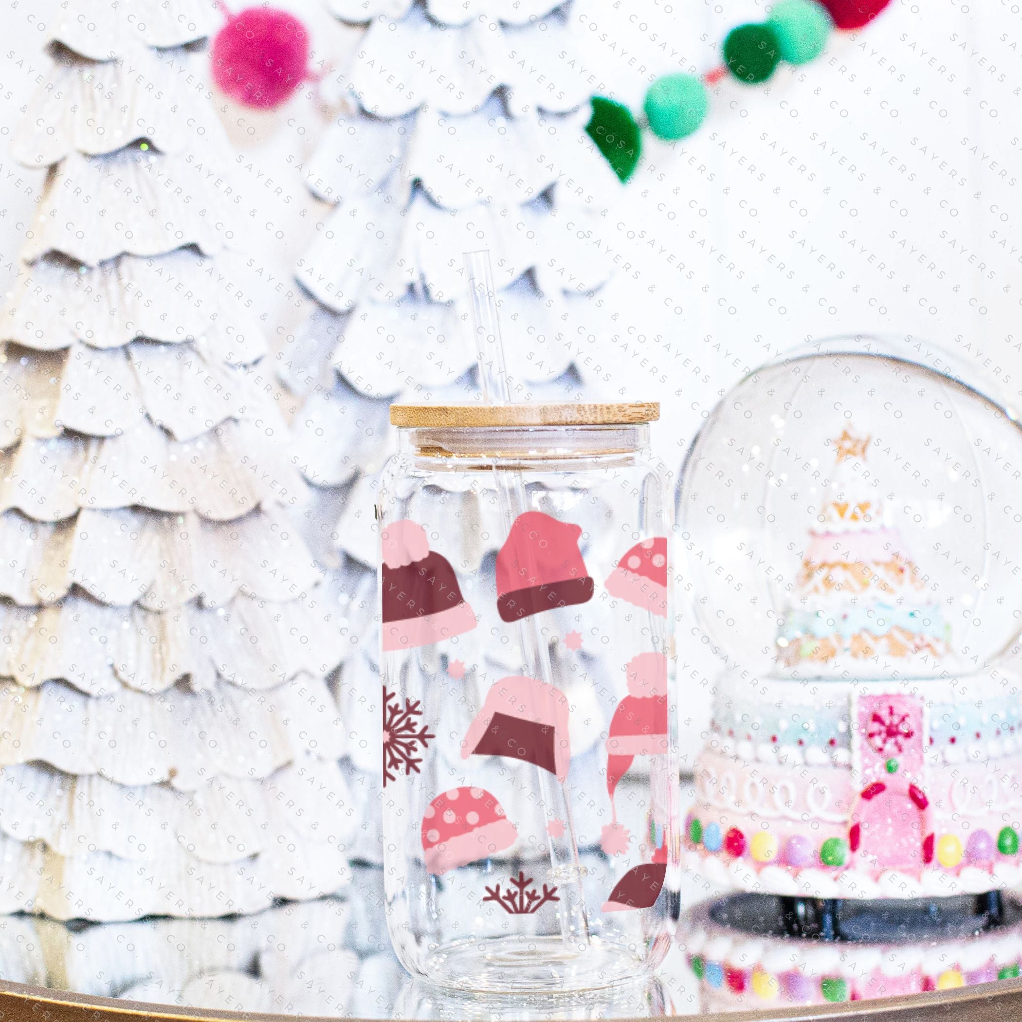 16oz Winter Beanies Glass Cup with bamboo lid and straw, featuring a festive winter design, perfect for holiday drinks.