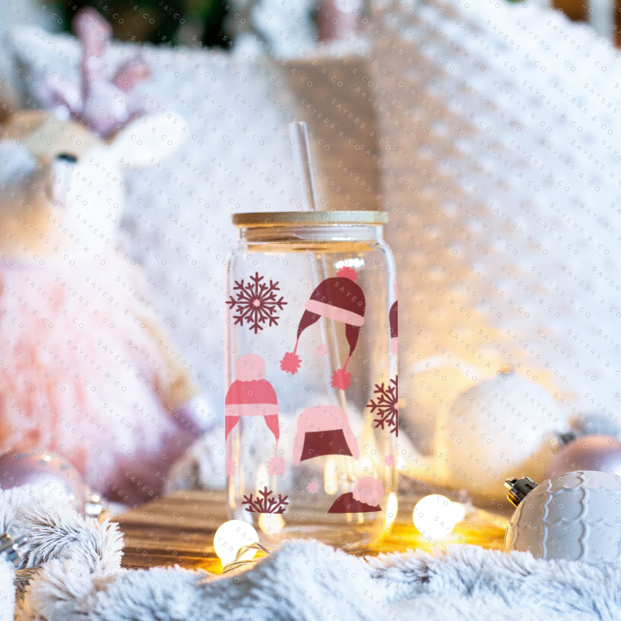 16oz Winter Beanies Glass Cup with bamboo lid and straw, featuring a festive winter design, perfect for holiday drinks.