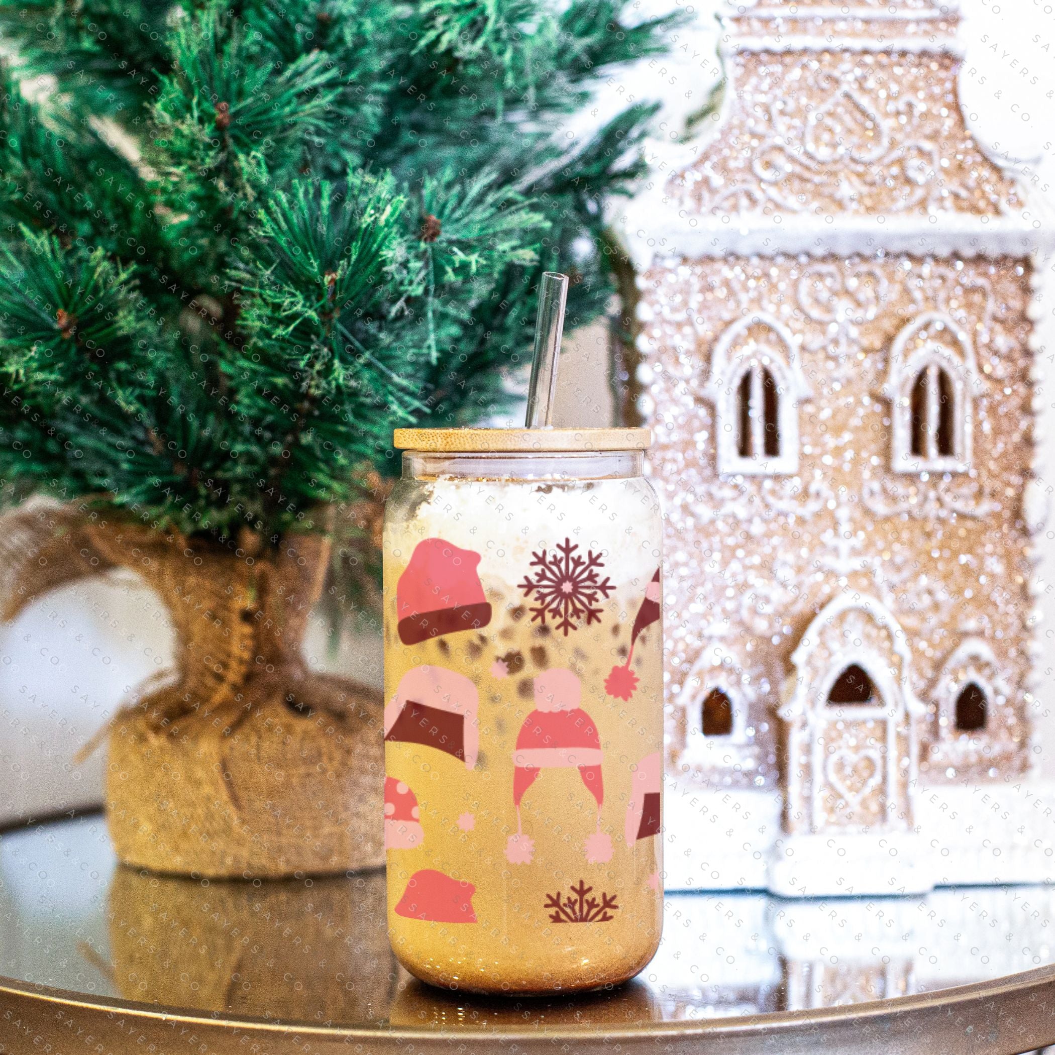 16oz Winter Beanies Glass Cup with bamboo lid and straw, featuring a festive winter design, perfect for holiday drinks.