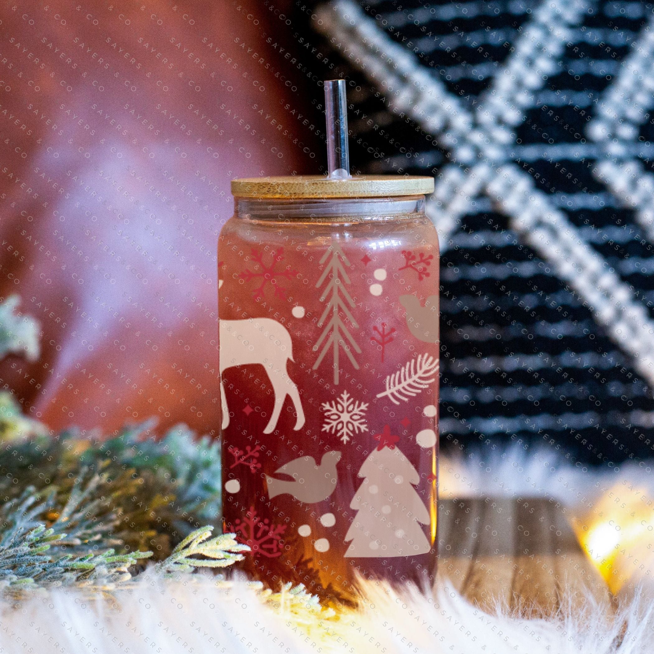 16oz Winter Magic Glass Cup with Bamboo Lid and Straw, featuring winter-themed designs and a clear glass finish.
