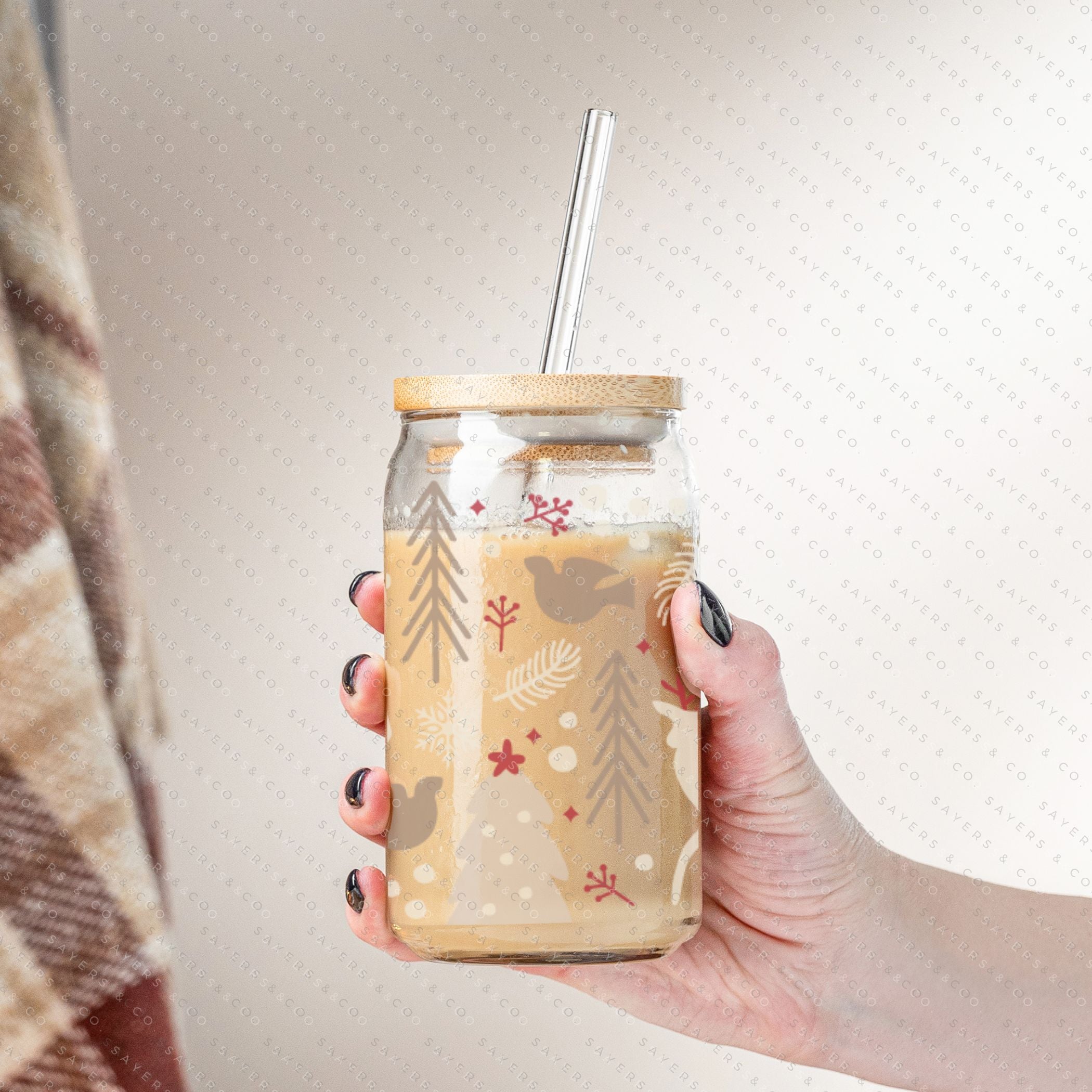 16oz Winter Magic Glass Cup with Bamboo Lid and Straw, featuring winter-themed designs and a clear glass finish.