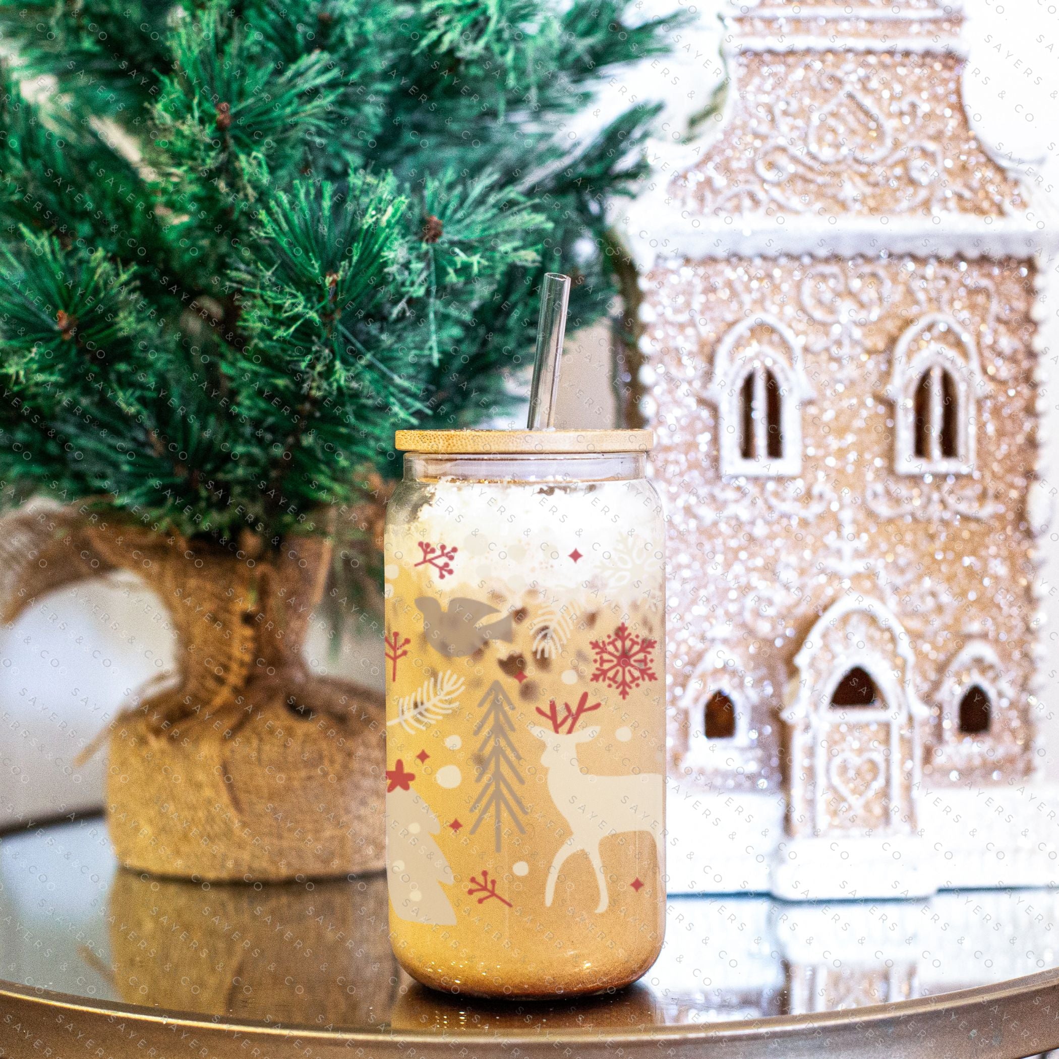 16oz Winter Magic Glass Cup with Bamboo Lid and Straw, featuring winter-themed designs and a clear glass finish.