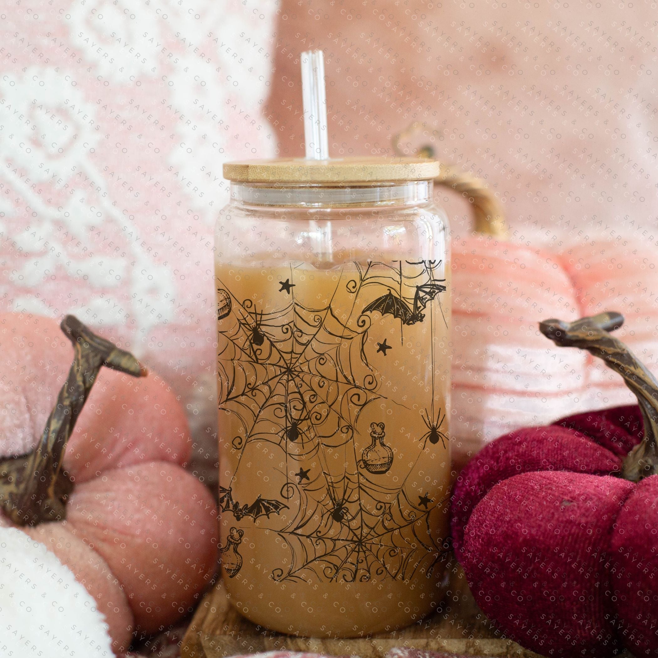 16oz Witches Brew Glass Cup with bamboo lid and straw, featuring a whimsical design perfect for fall and Halloween.