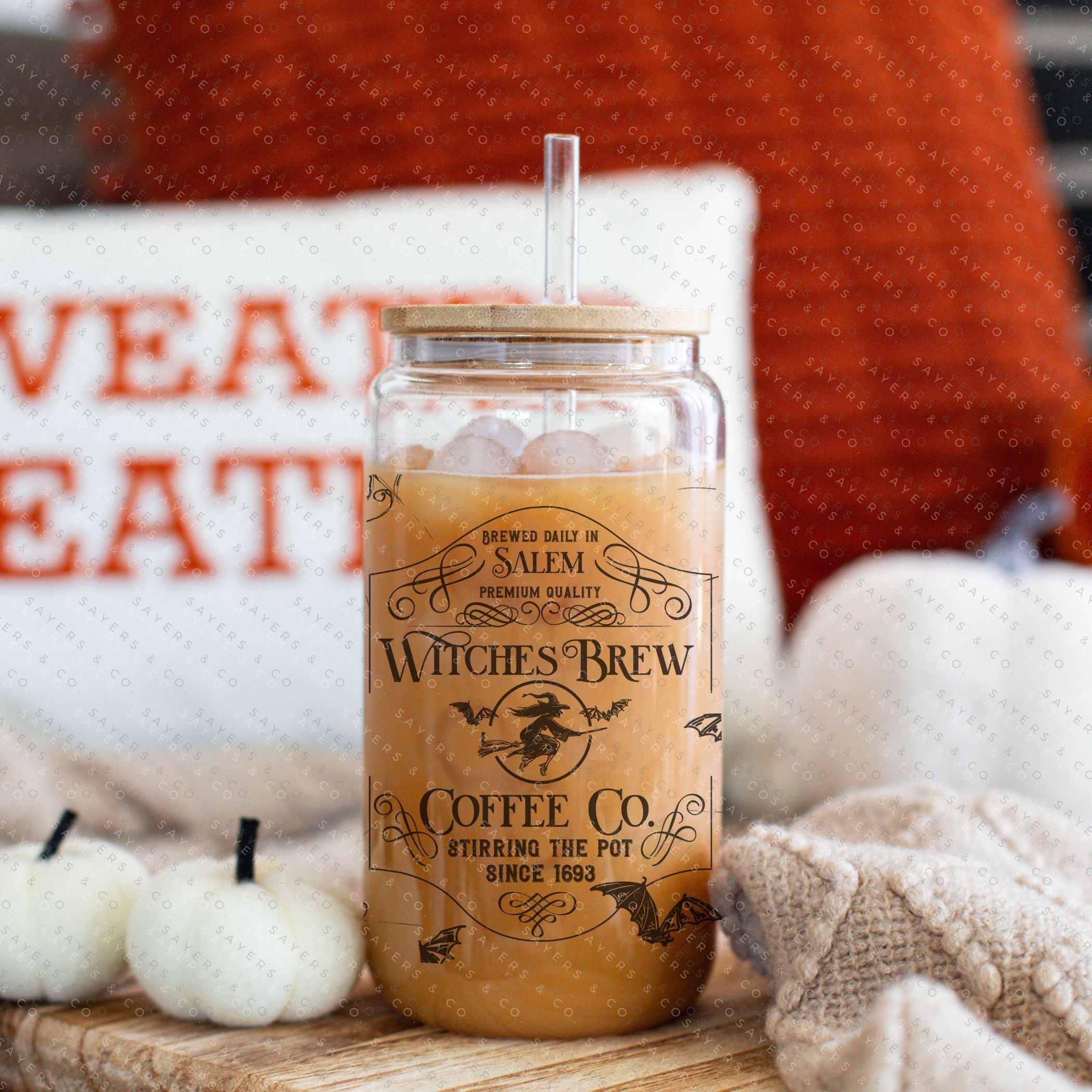 16oz Witches Brew Glass Cup with bamboo lid and straw, featuring a whimsical design perfect for fall and Halloween.