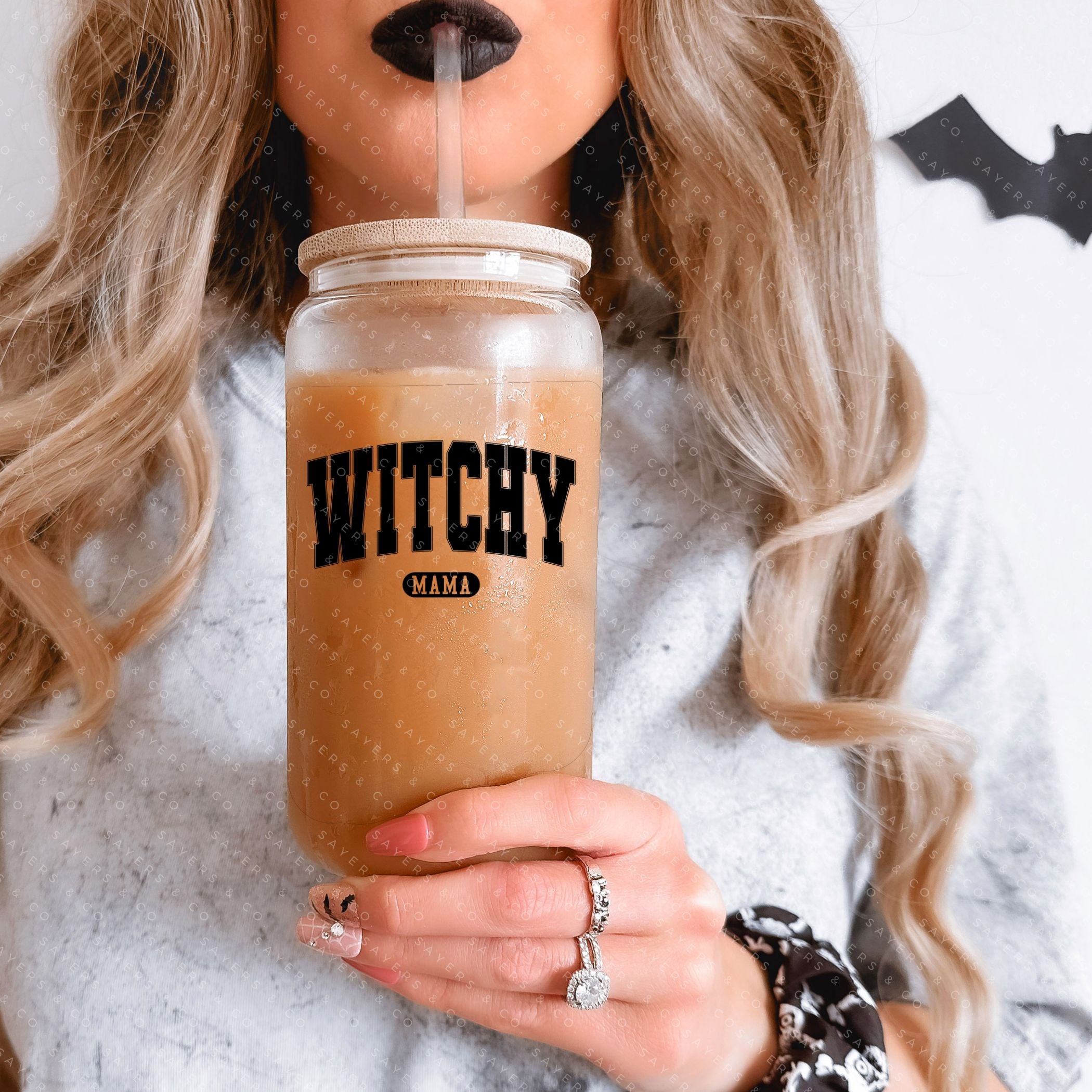 16oz Witchy Mama Glass Cup with bamboo lid and straw, featuring a whimsical design perfect for Halloween and everyday use.