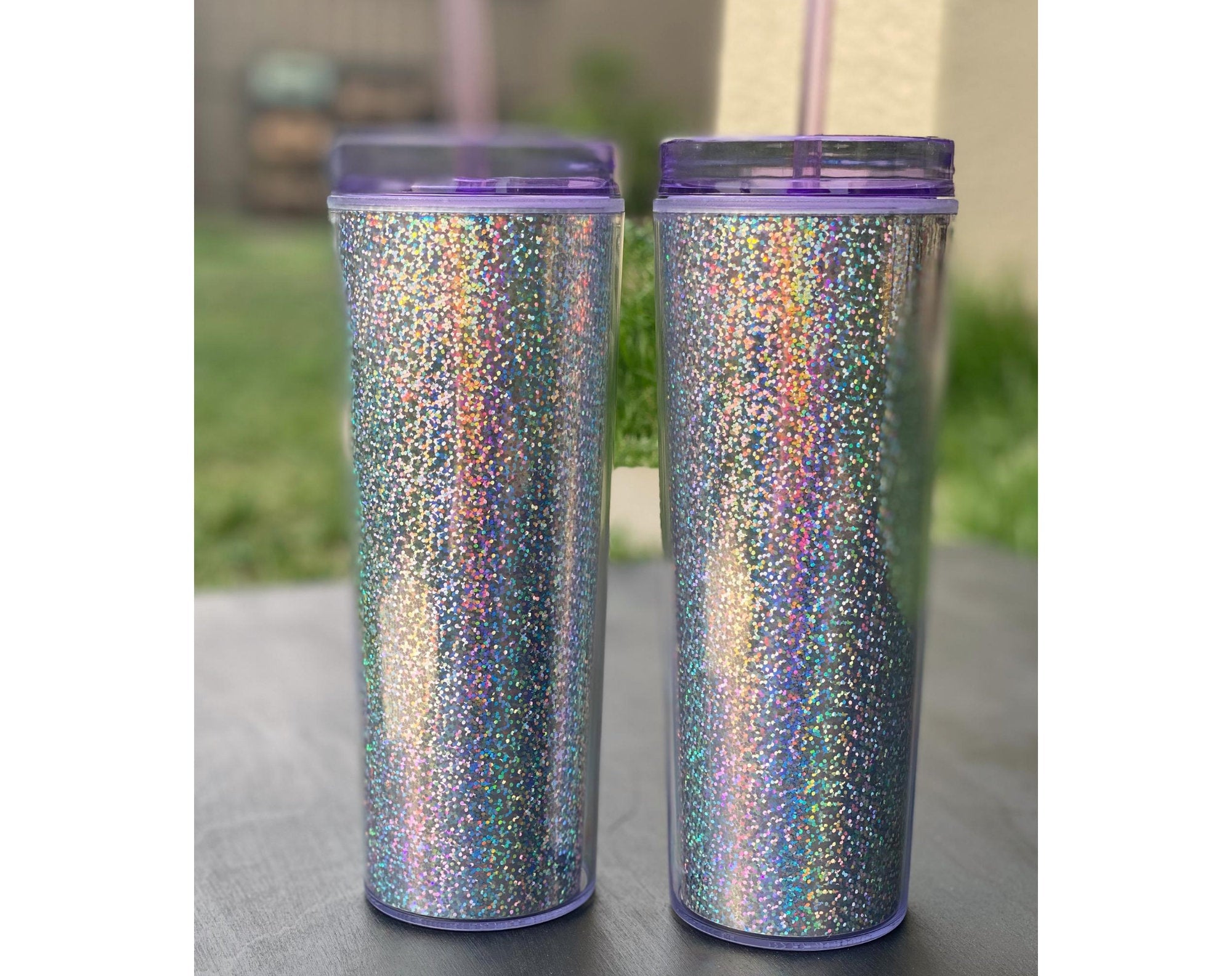 20 oz Blank Holographic Glitter Acrylic Tumbler with purple lid and straw, showcasing a sparkling glitter finish.
