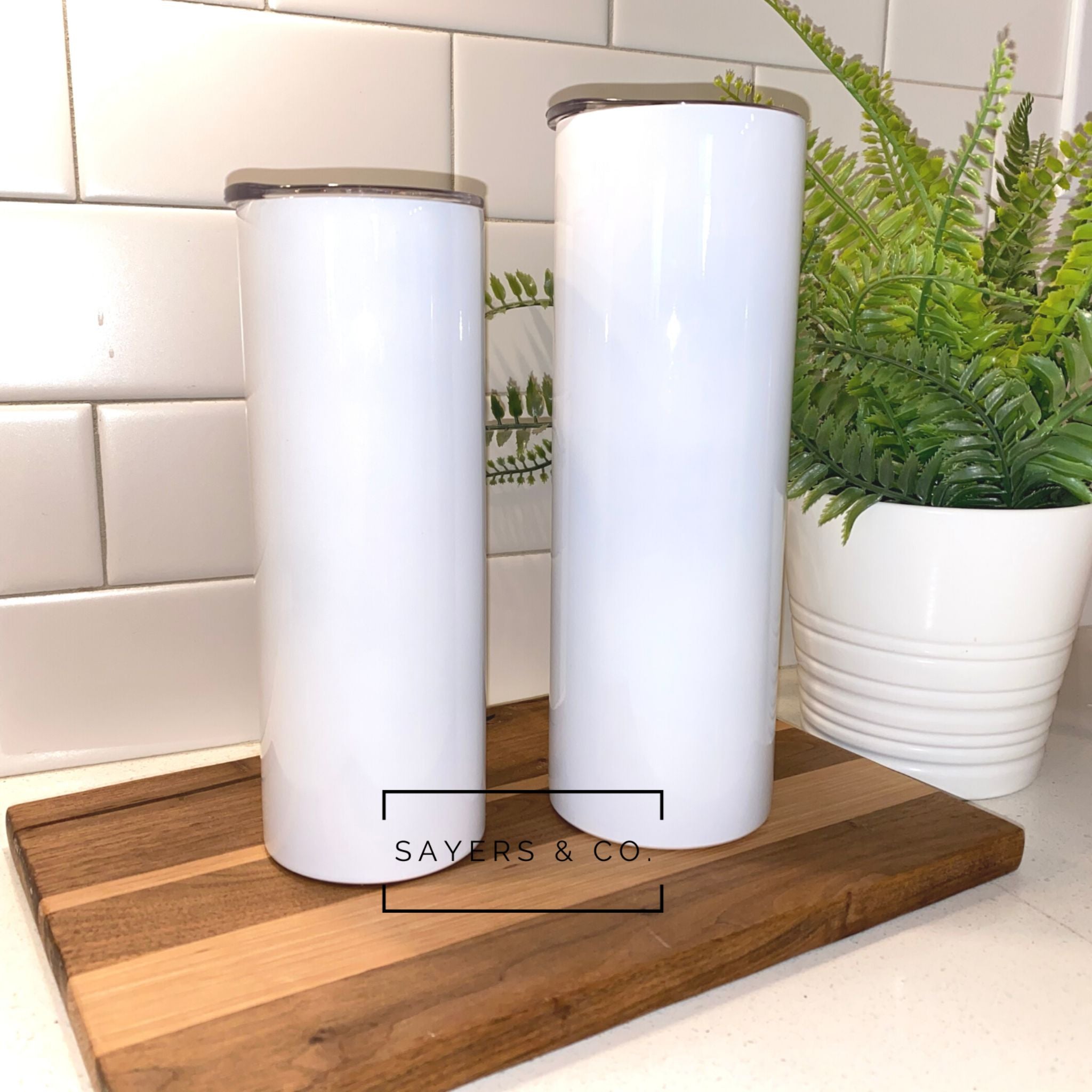 20oz and 30oz skinny straight white sublimation tumblers with straws, showcasing a sleek design for stylish beverage enjoyment.