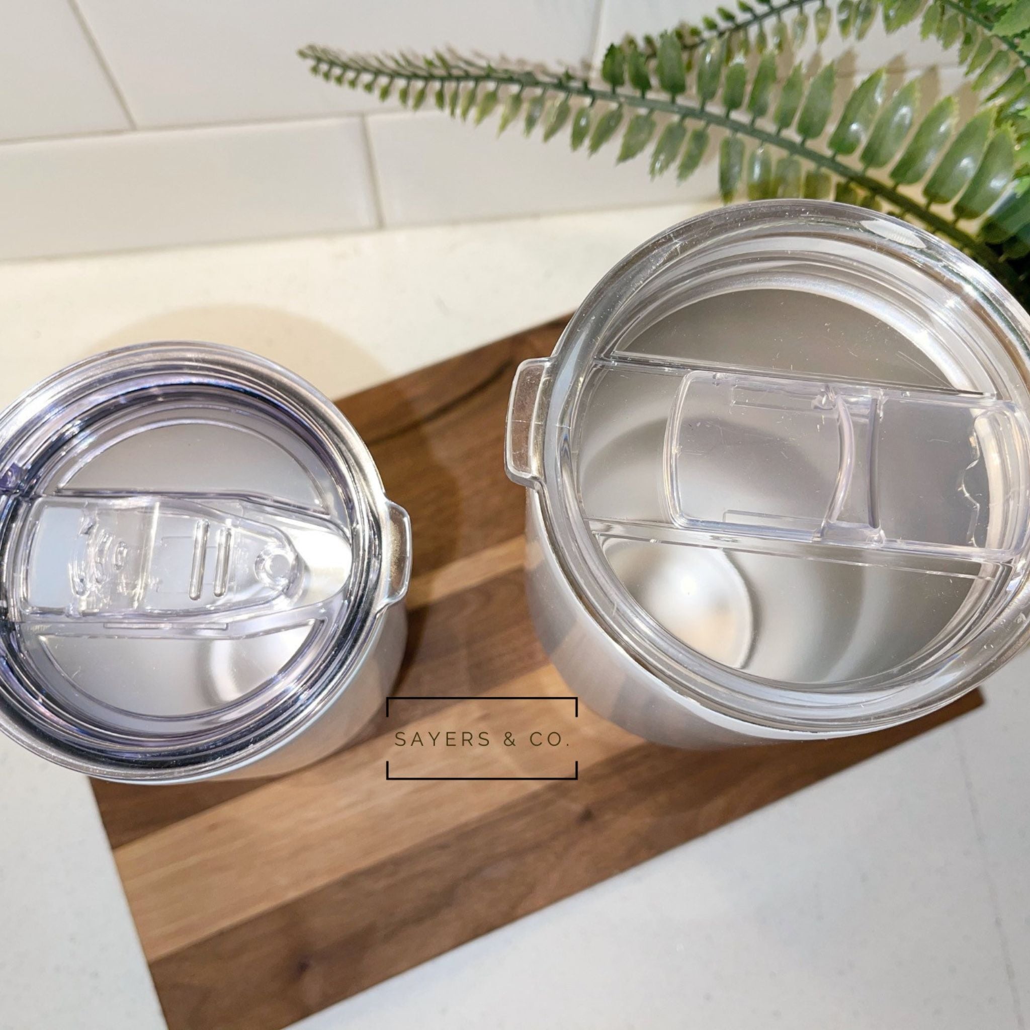 20oz and 30oz white stainless steel sublimation tumblers with metal straws, ideal for custom designs.