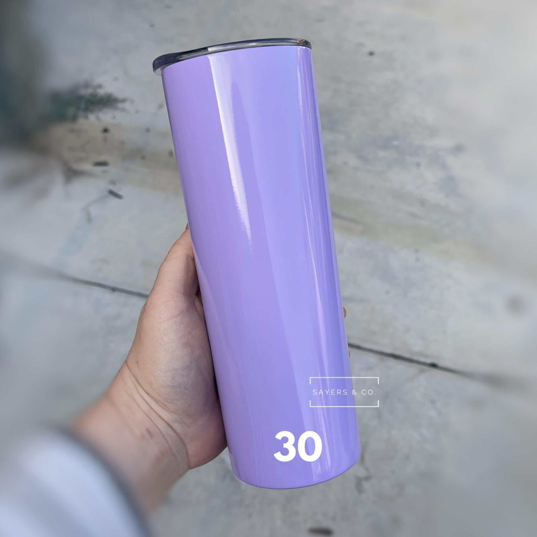 A 20oz skinny tumbler in solid colors, featuring a straw and packaged in a white box, ideal for customization.