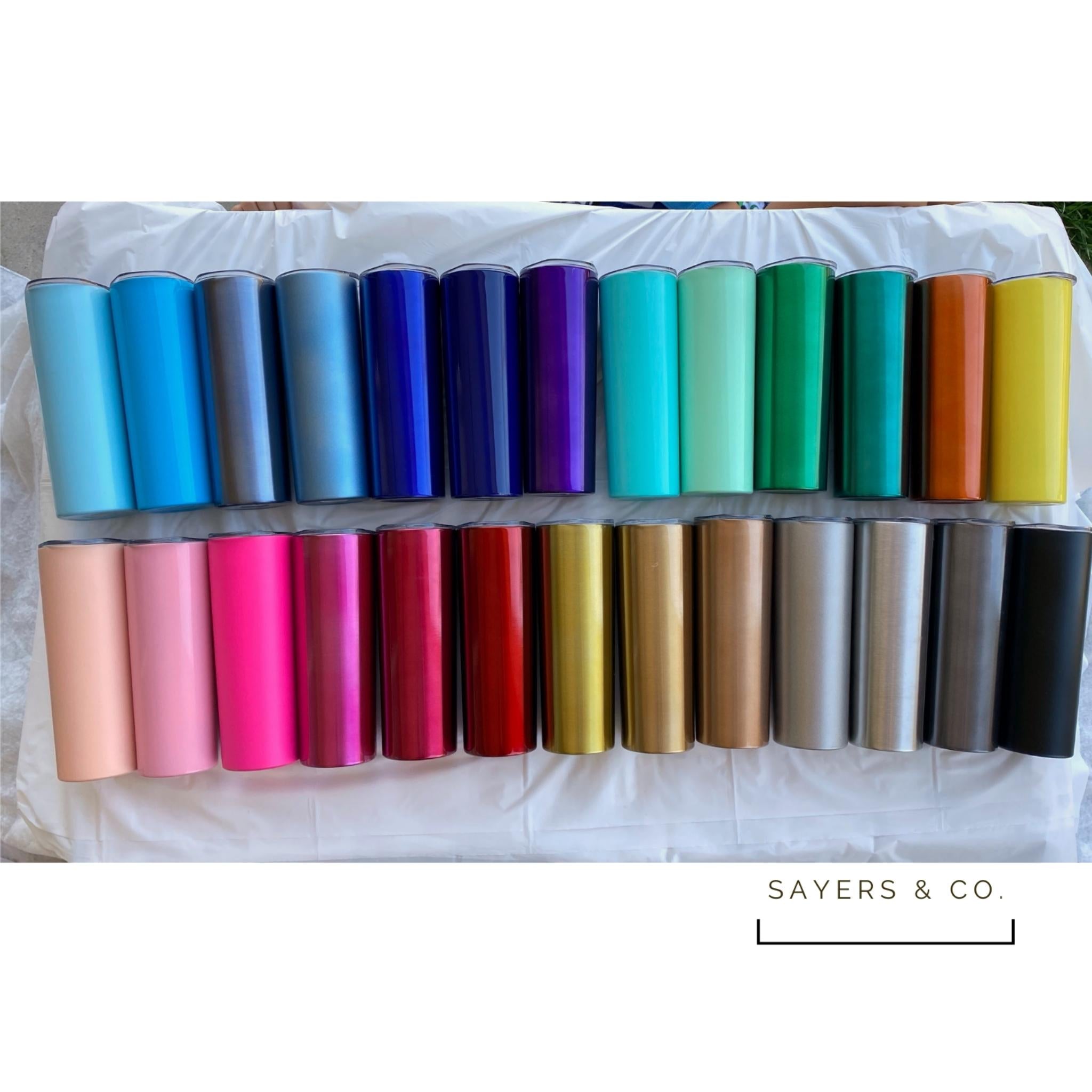 A 20oz skinny tumbler in solid colors, featuring a straw and packaged in a white box, ideal for customization.