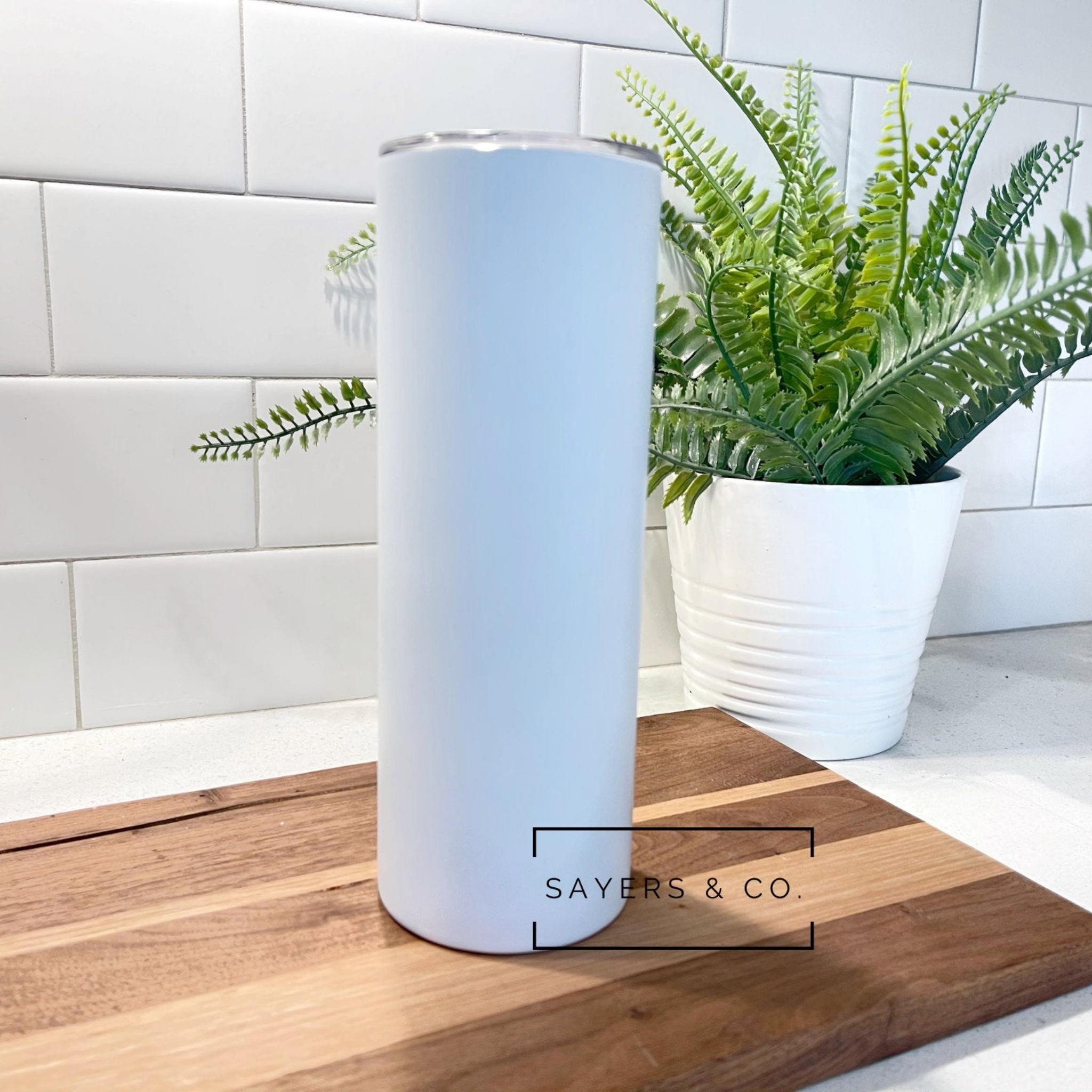 20oz Matte White Sublimation Skinny Tumbler with straw and non-slip bottom, perfect for custom designs.