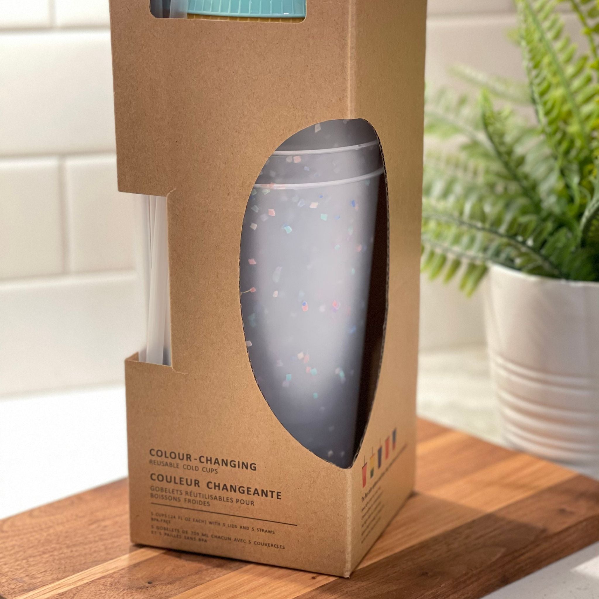 A pack of five 24oz color changing confetti cold cups with straws and lids, showcasing vibrant colors and a fun design.