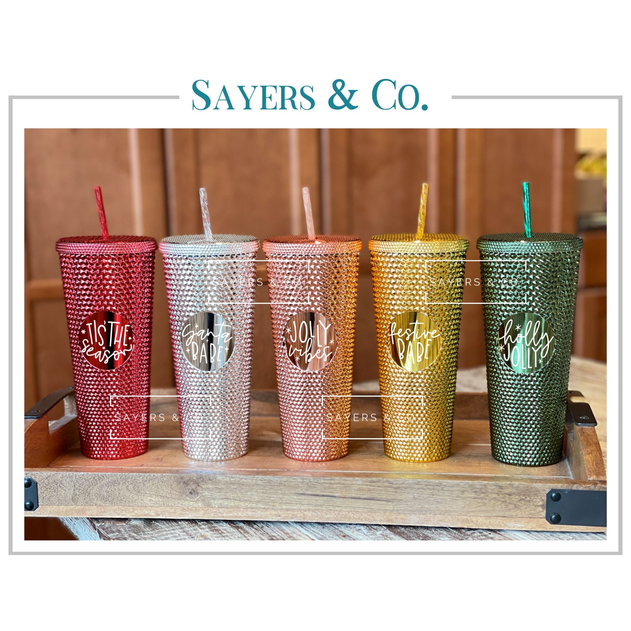A stylish 24oz custom holiday tumbler with a studded design, featuring a screw top and a matching straw, perfect for hot and cold beverages.