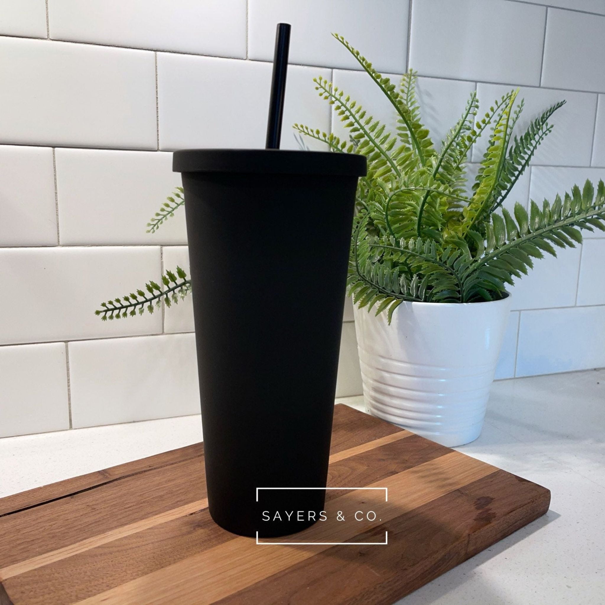 A 22oz Acrylic Matte Colored Double Walled Tumbler in various colors with a screwtop lid and matching straw, showcasing its stylish design.