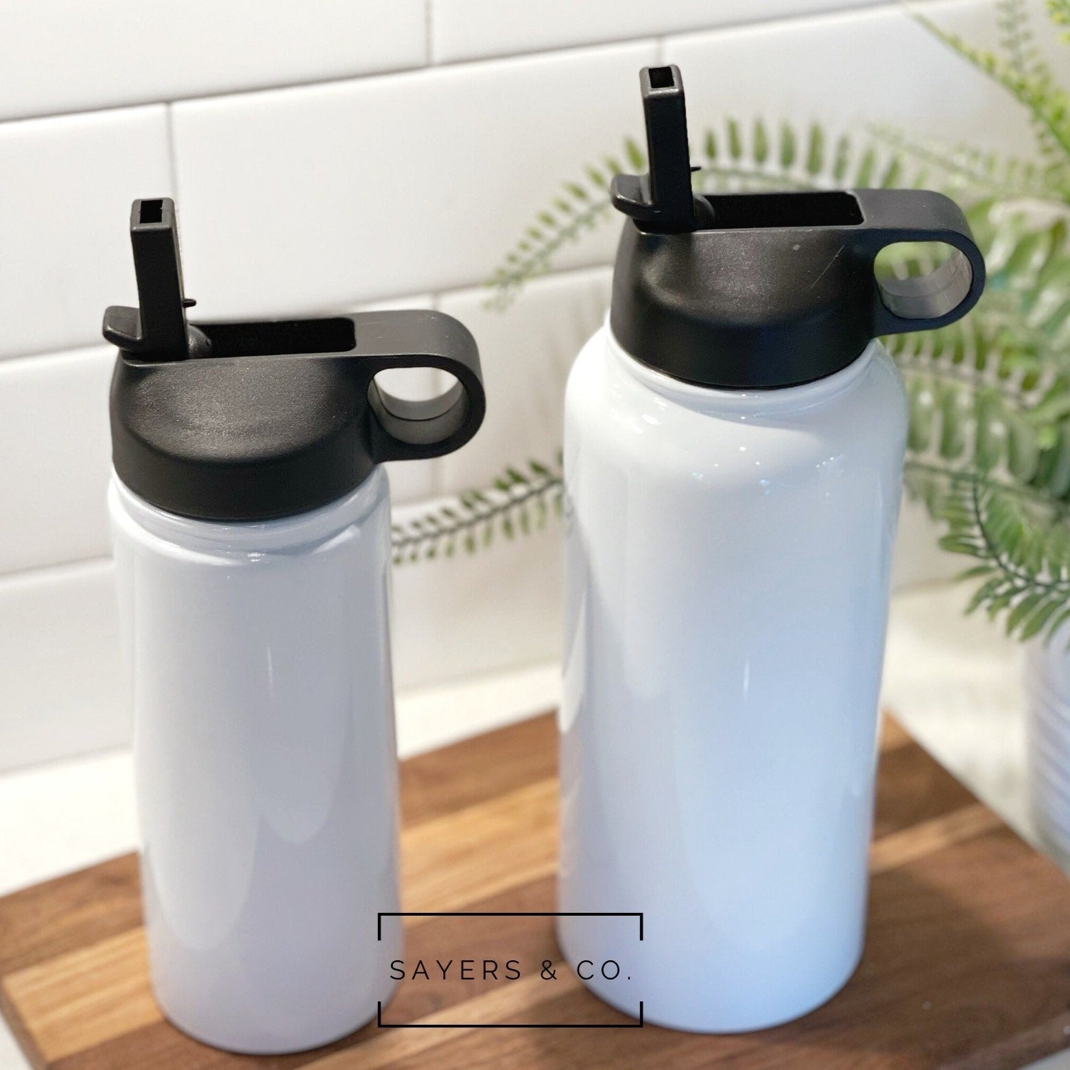 32oz and 18oz white sublimation sport bottle tumblers made of stainless steel, ideal for custom designs.