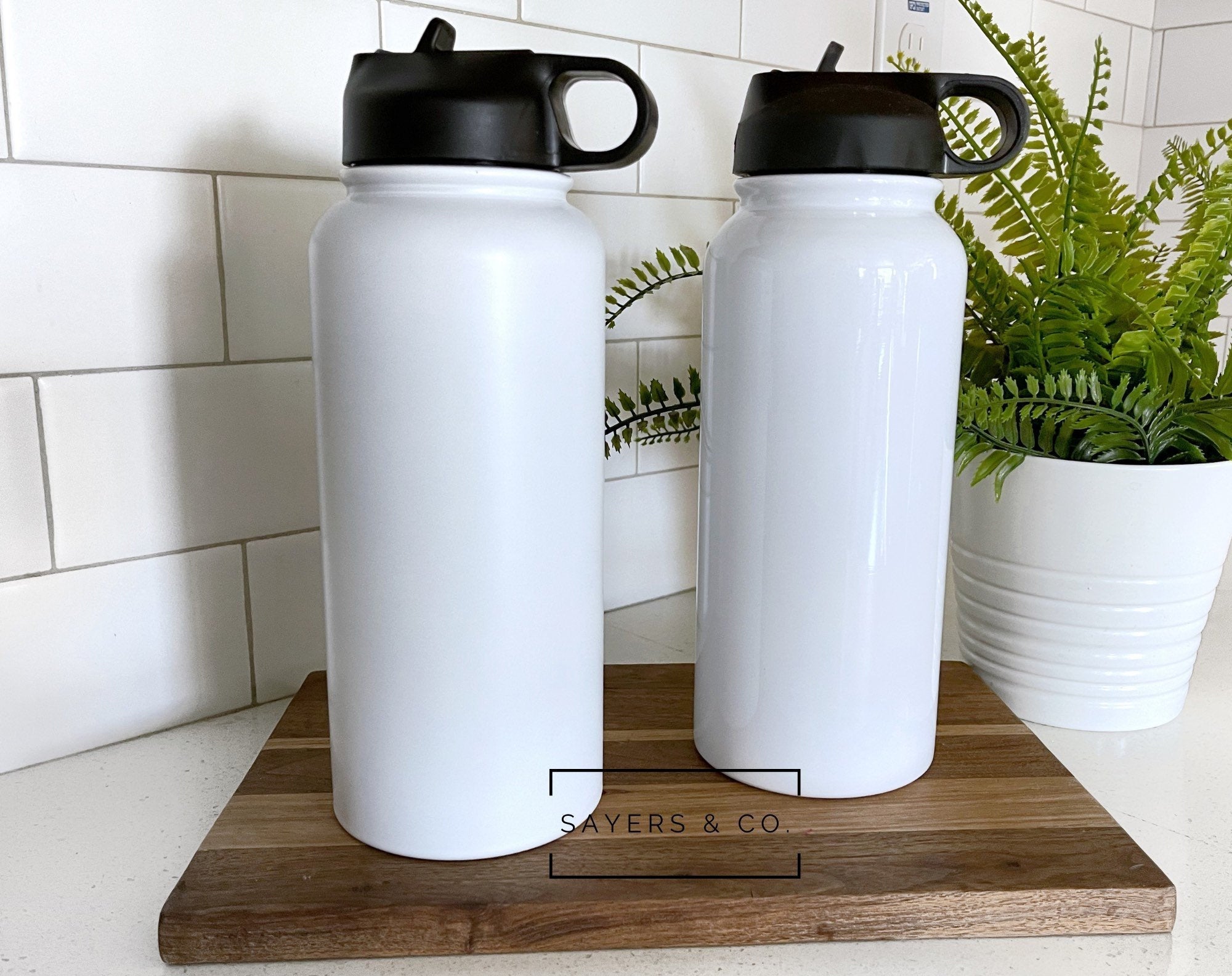 32oz and 18oz white sublimation sport bottle tumblers made of stainless steel, ideal for custom designs.