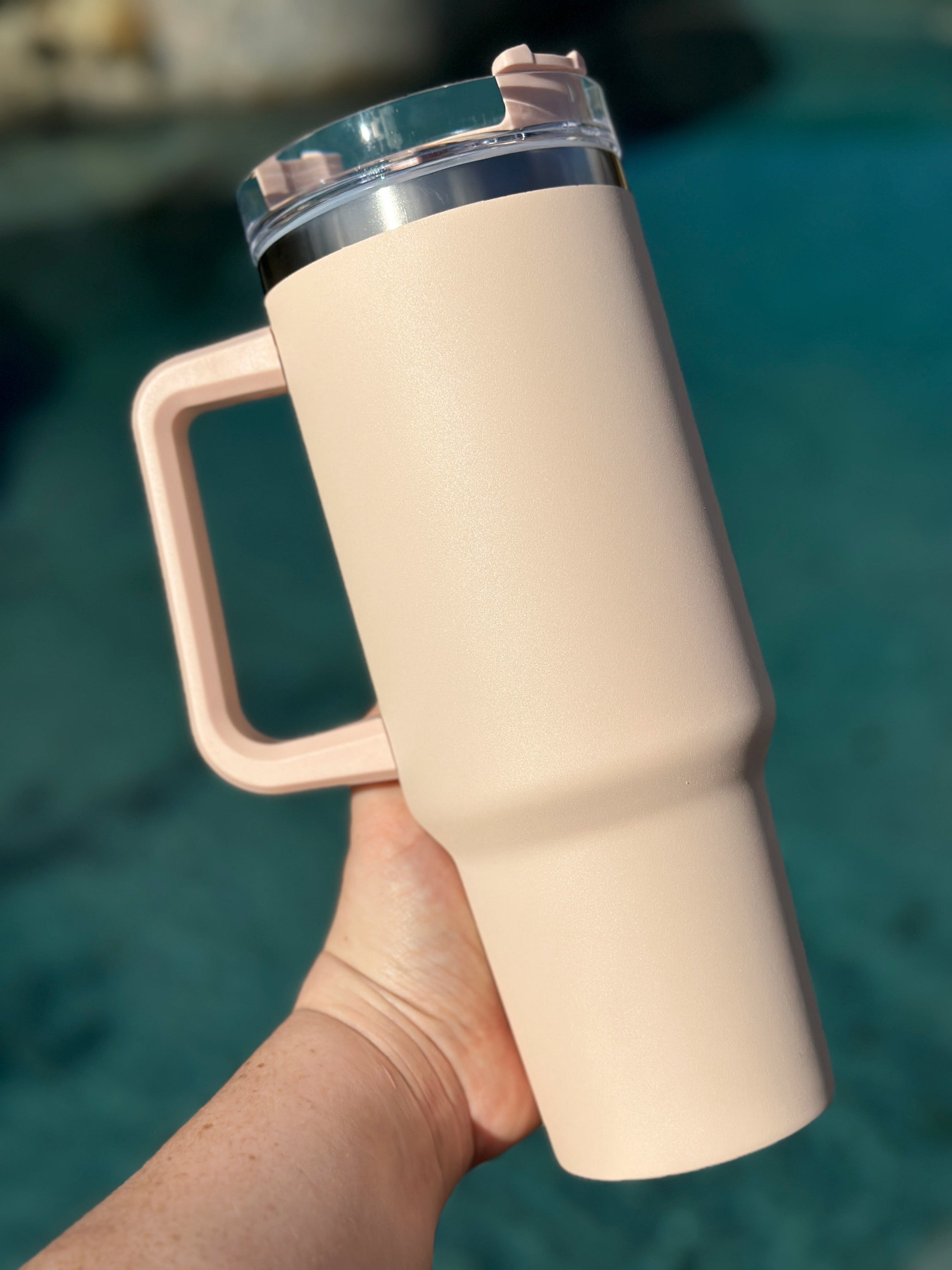 40 oz double walled insulated tumbler in various colors with a screw top lid and straw, perfect for customization.